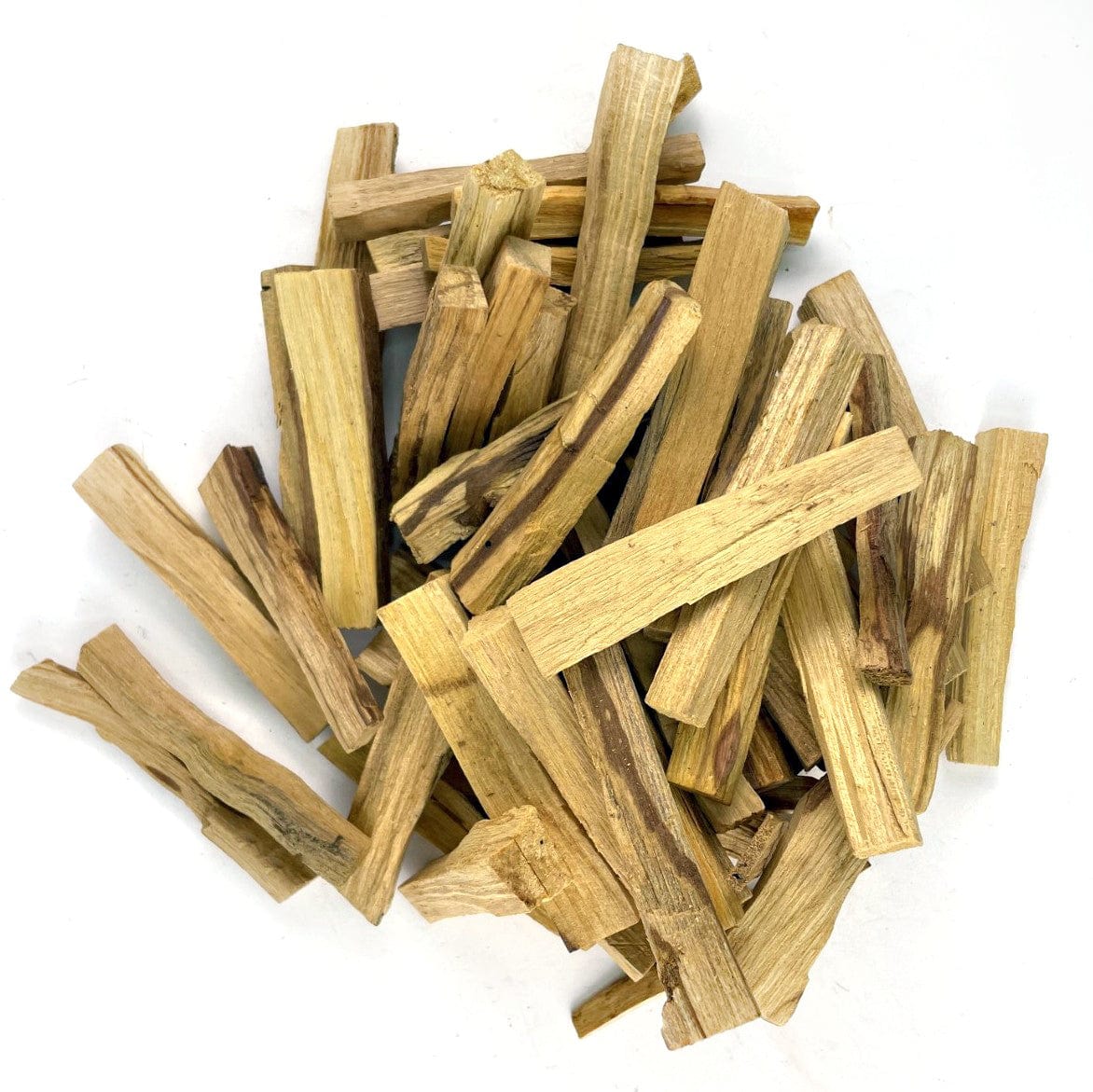 A pile of palo santo sticks on a white background.