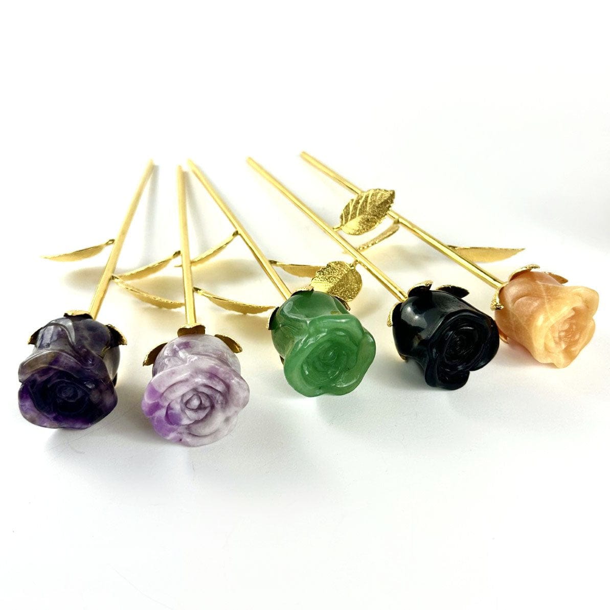 Crystal Rose - Carved Stones displayed on a table