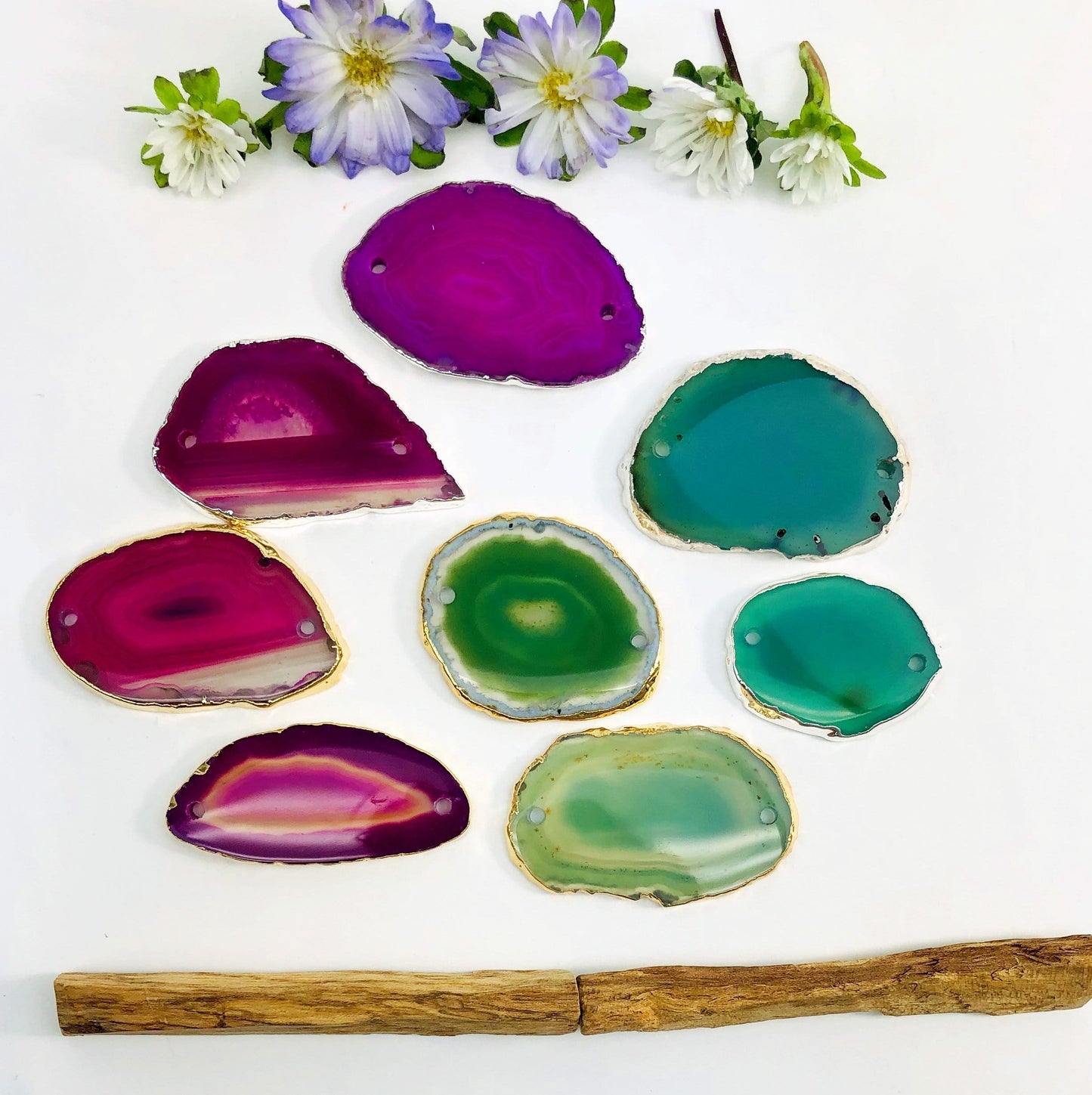 Picture of our pink and green agate slice plated edge being displayed on a white back ground. 