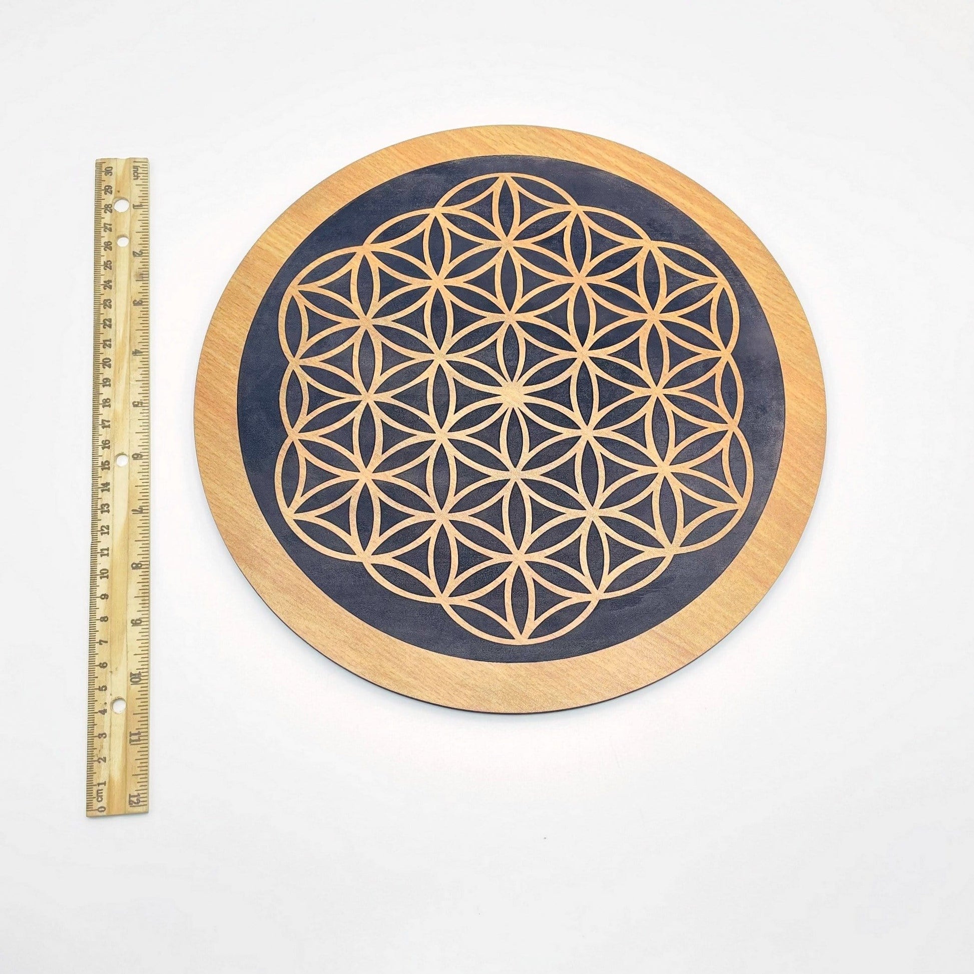 crystal grid next to a ruler for size reference