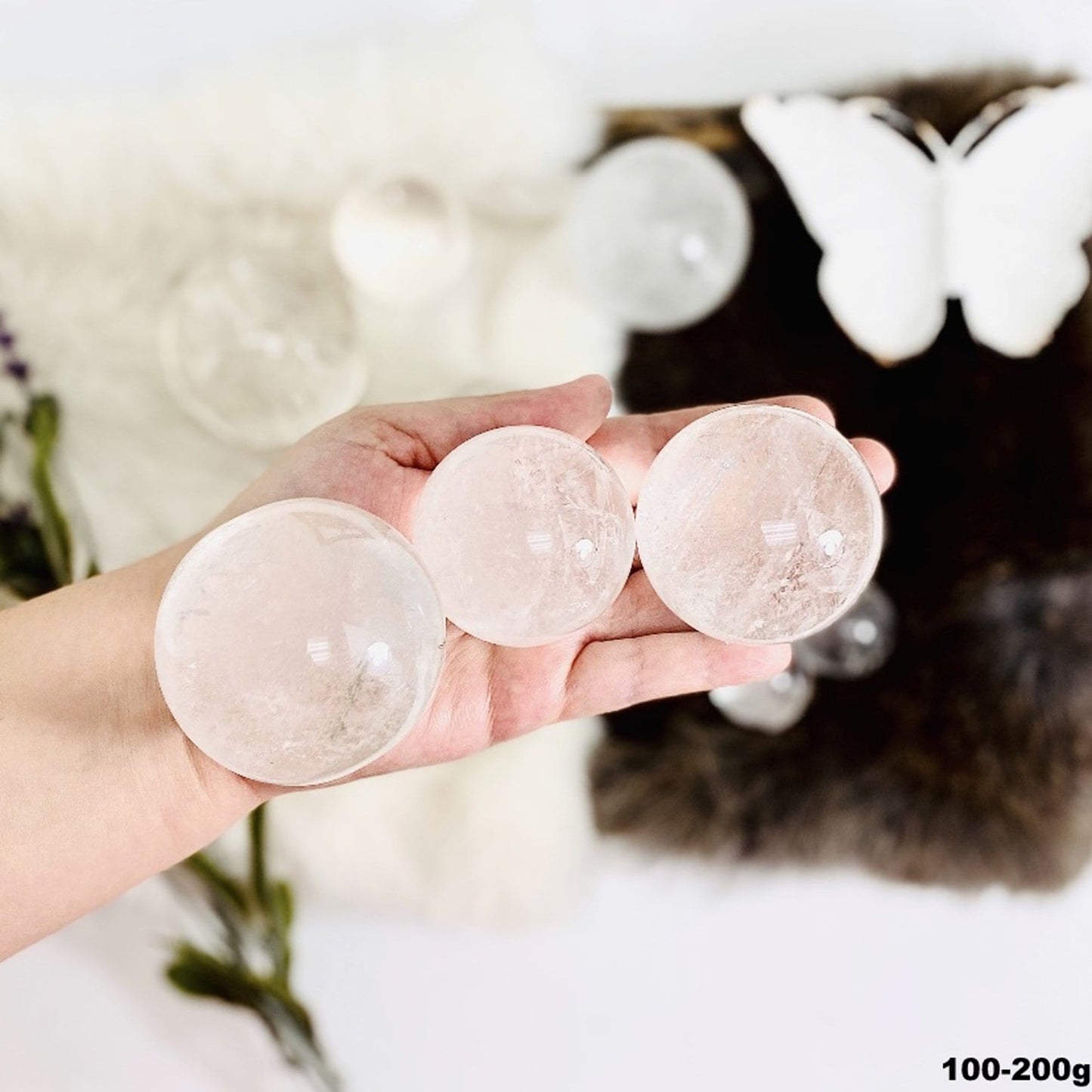 100-200g spheres displayed in hand for size reference