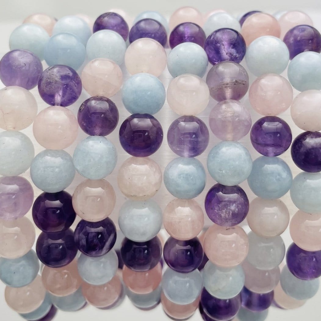 Up close of the bracelets to show rose quartz blue calcite amethyst characteristics