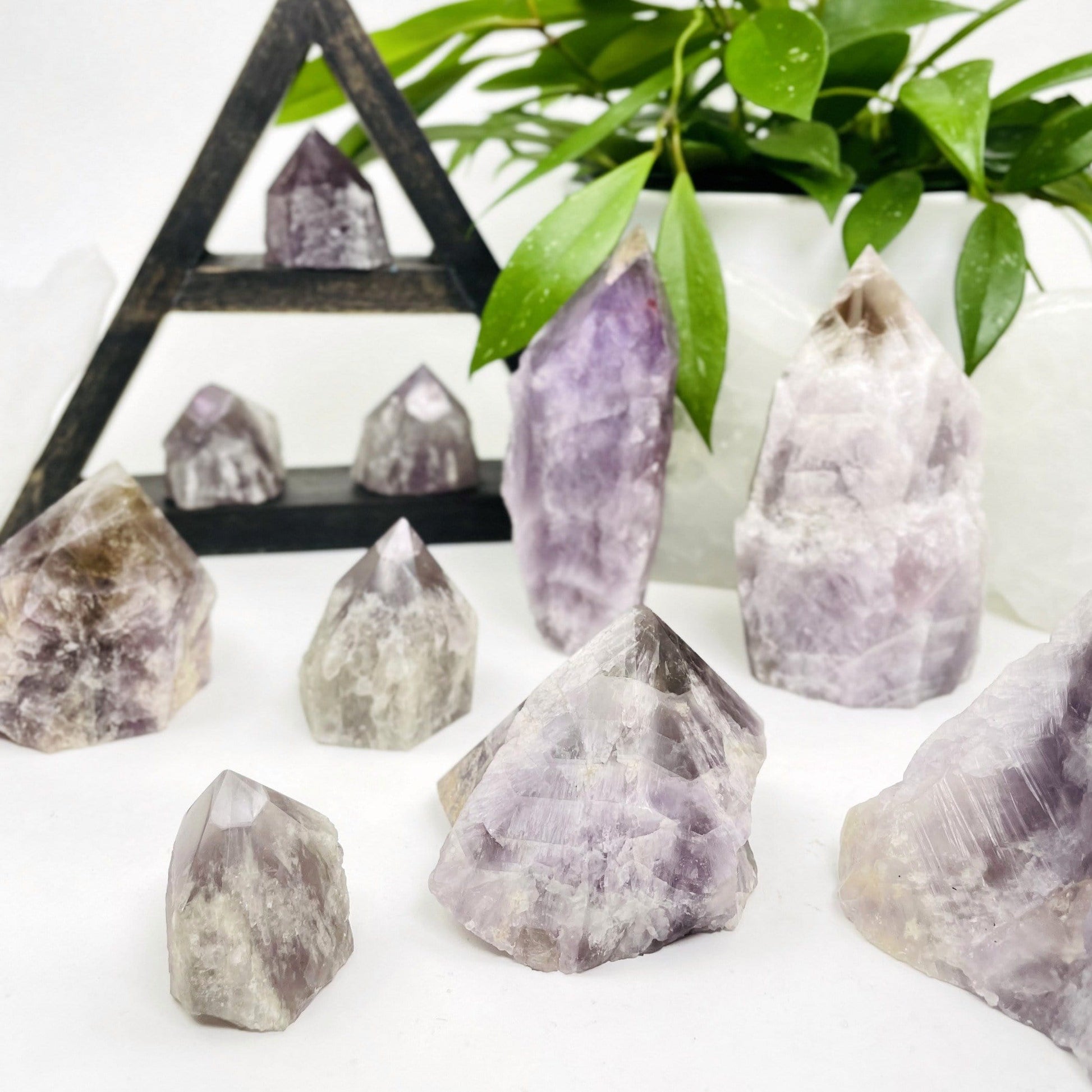 multiple seven minerals in one polished points showing different sizes and patterns 