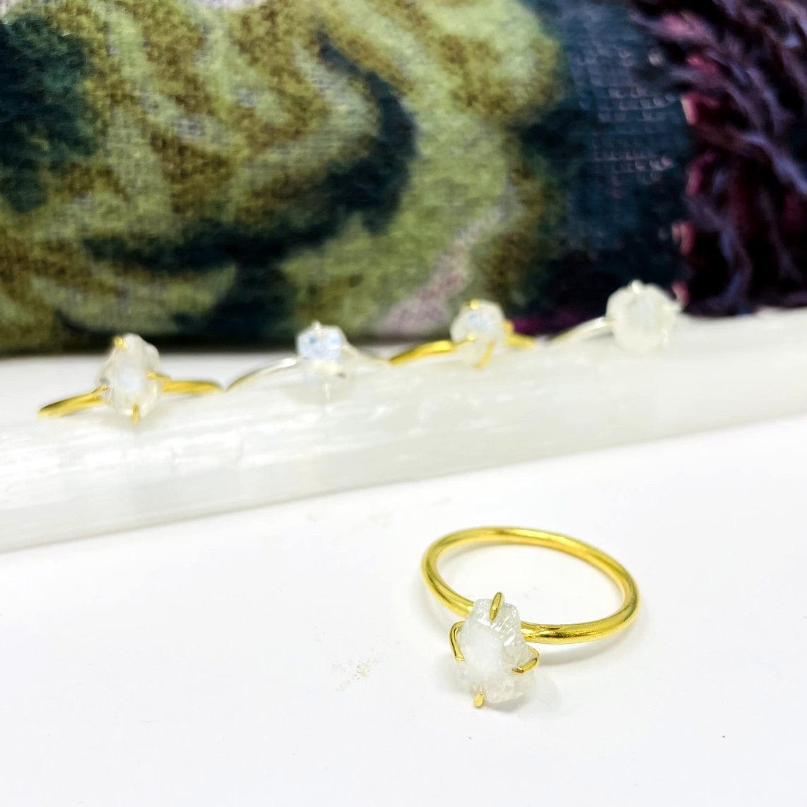 close up of the gemstone rings. available in gold or silver 