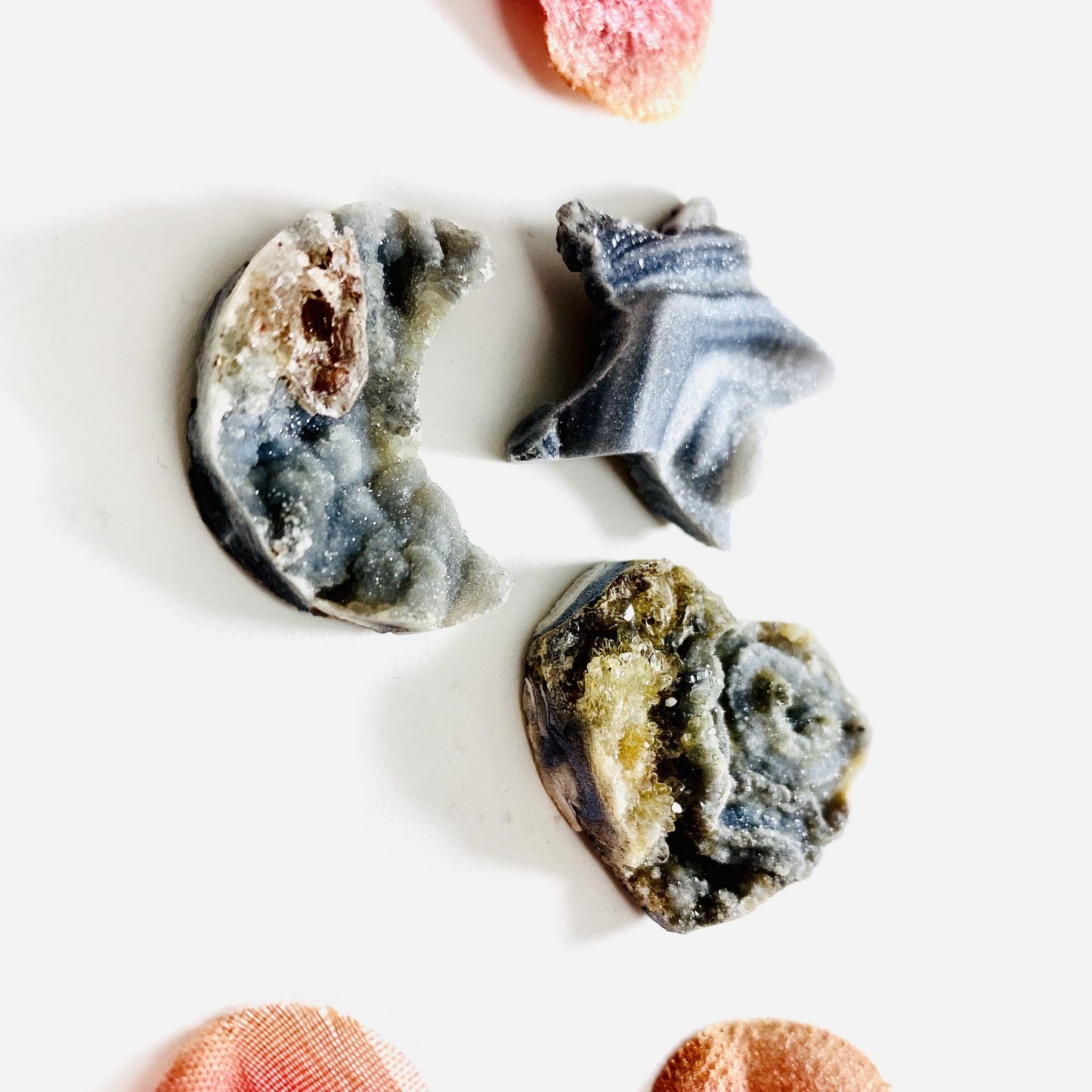 chalcedony heart star and moon on a table