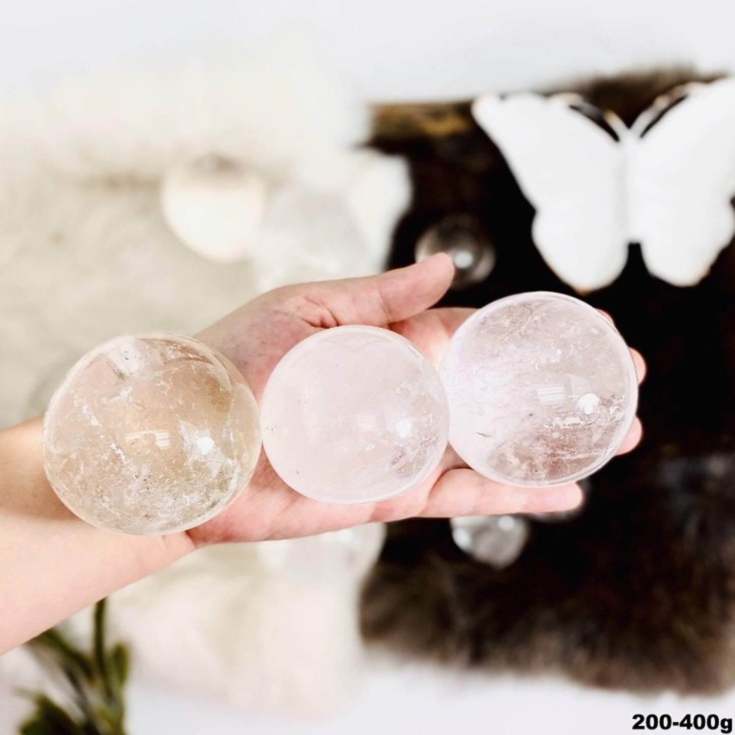 200-400g spheres displayed in hand for size reference