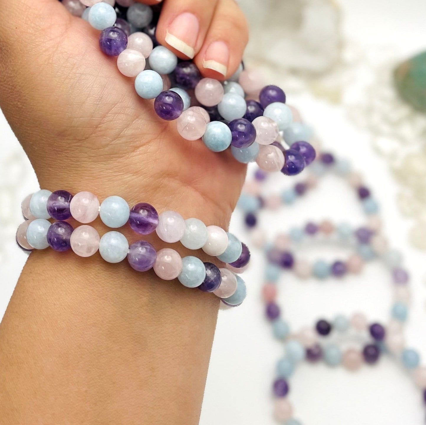 Gemstone bracelets displayed on wrist for size reference
