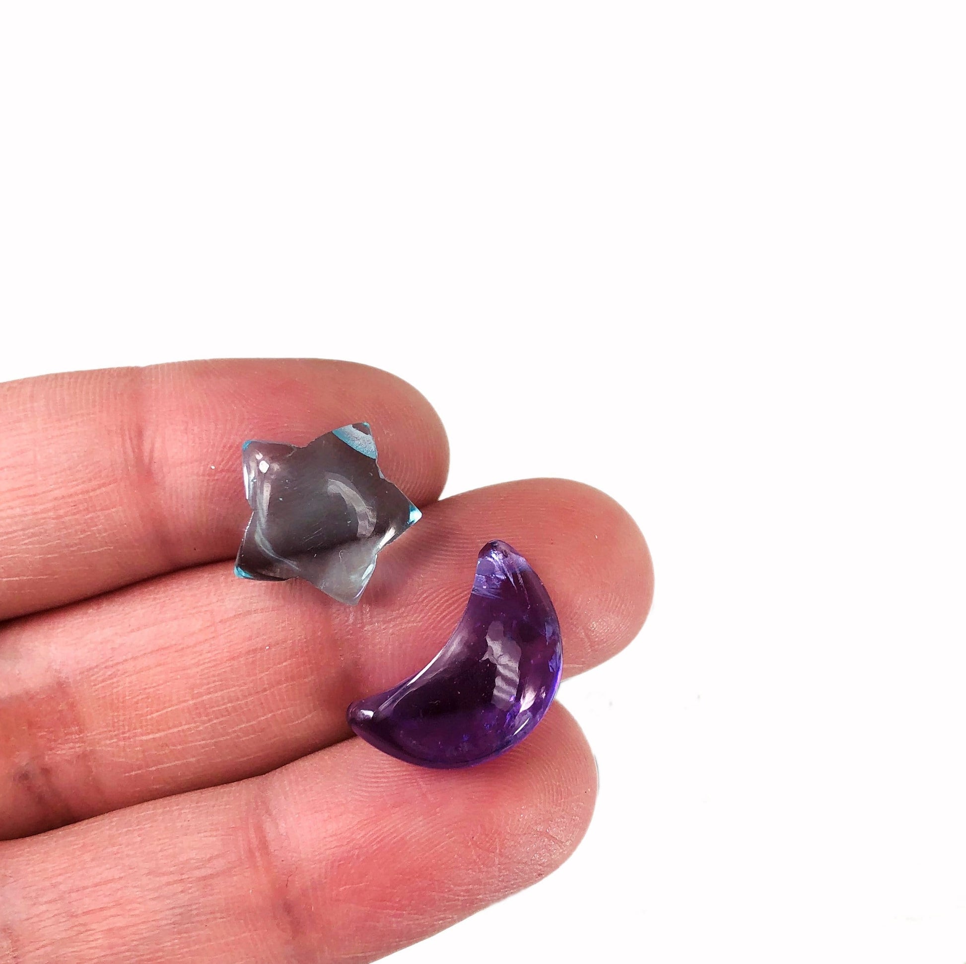 Gemstone Star and Moon Drilled Beads in a hand