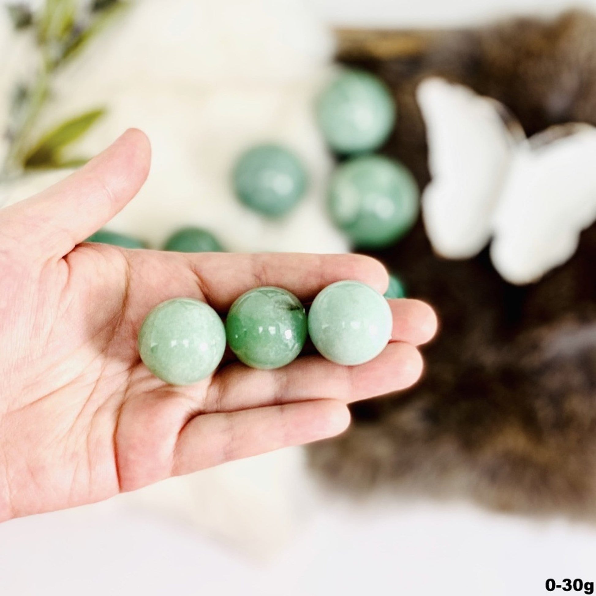 spheres in hand for size reference. showing the 0-30g size