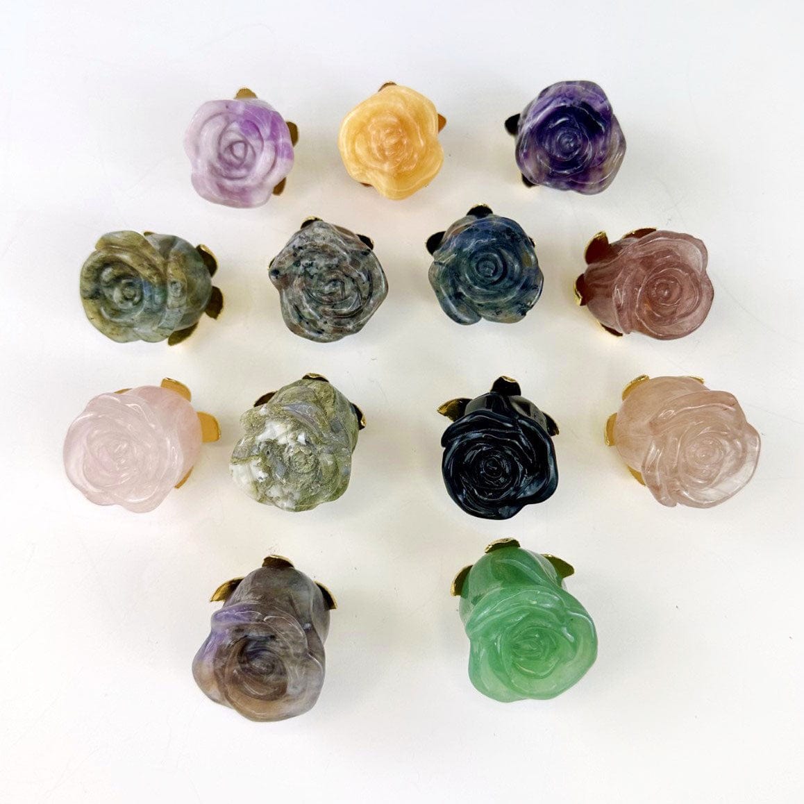 one of each stone that we have available, showing the carved petal detail