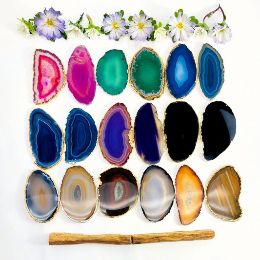 This picture is showing all the variety of colors we have available for our agate slices plated edge, on a white background.