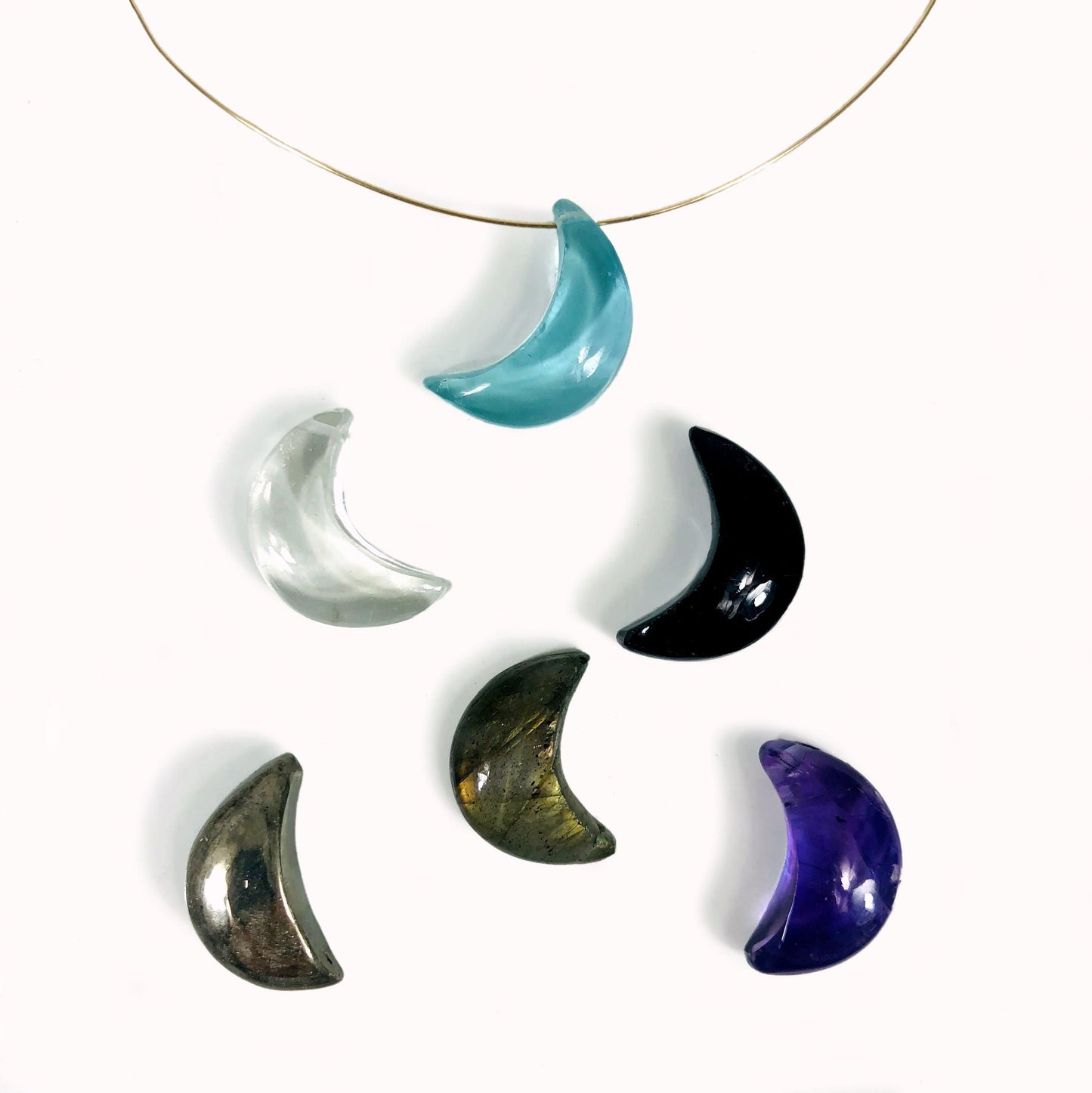 gemstone moon beads on a table