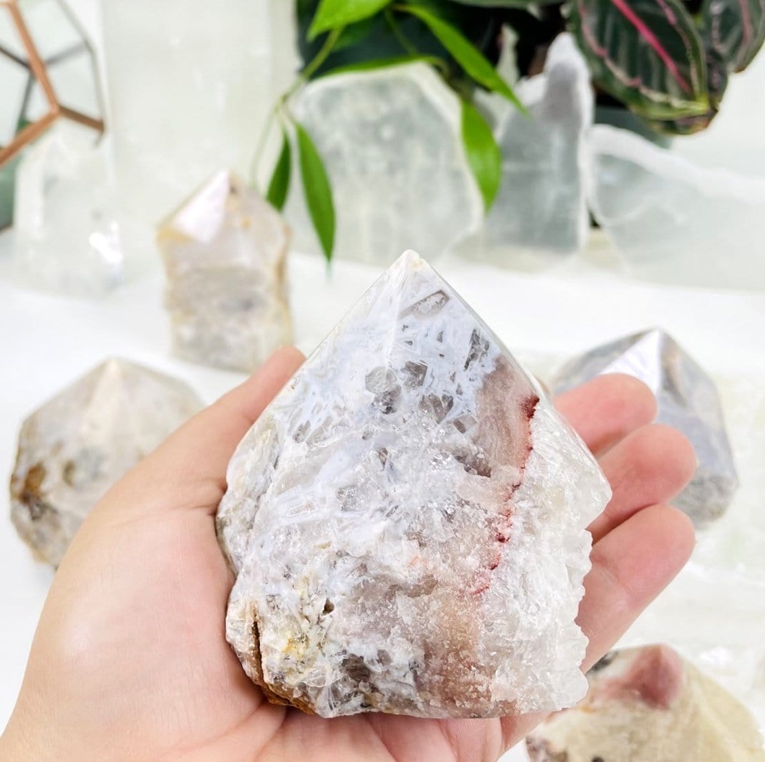 Pink Amethyst Point - Semi-polished Point in a hand showing different markings of this stock