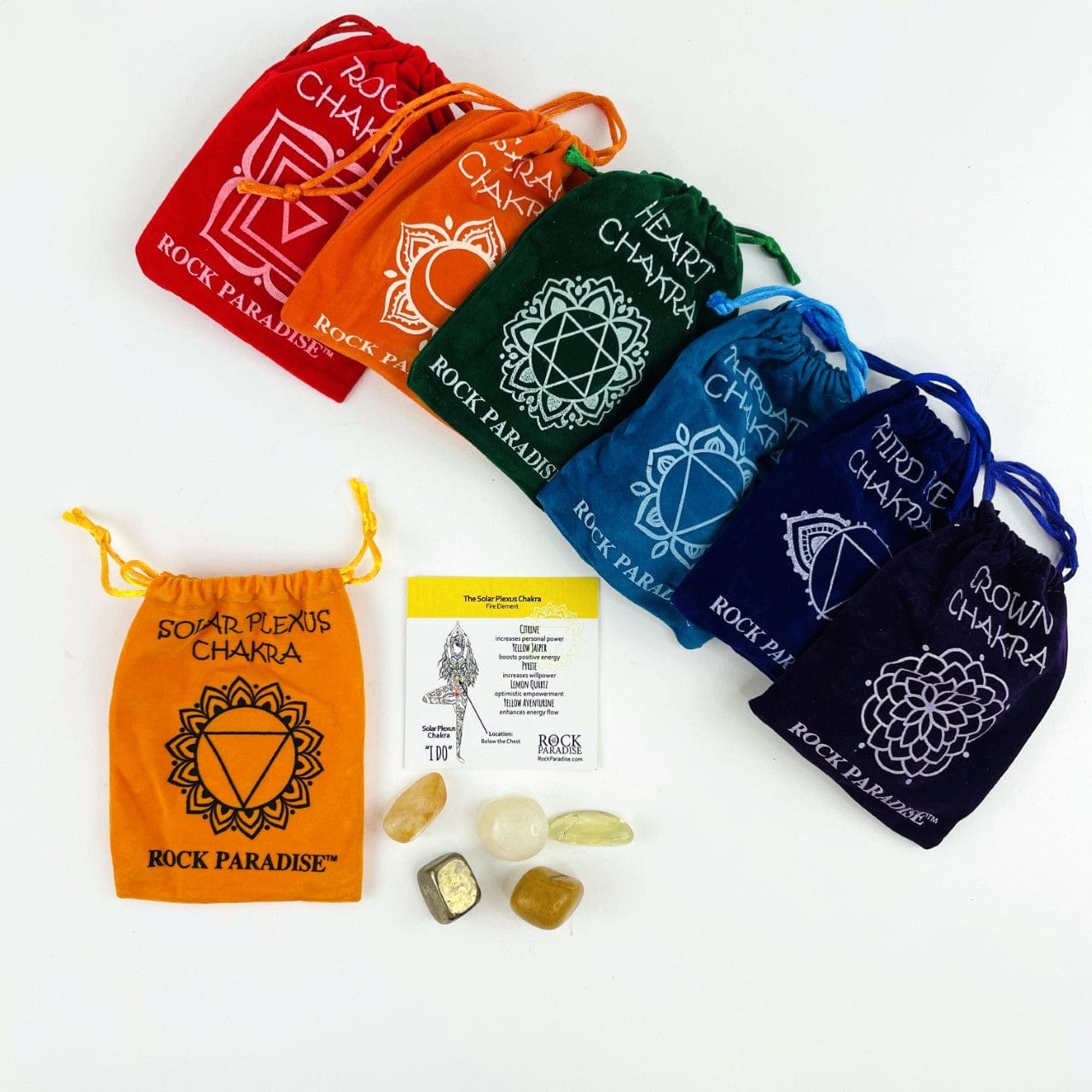 The Solar Plexus set opened up with the stones and information card beside it. All the other sets are lined up behind