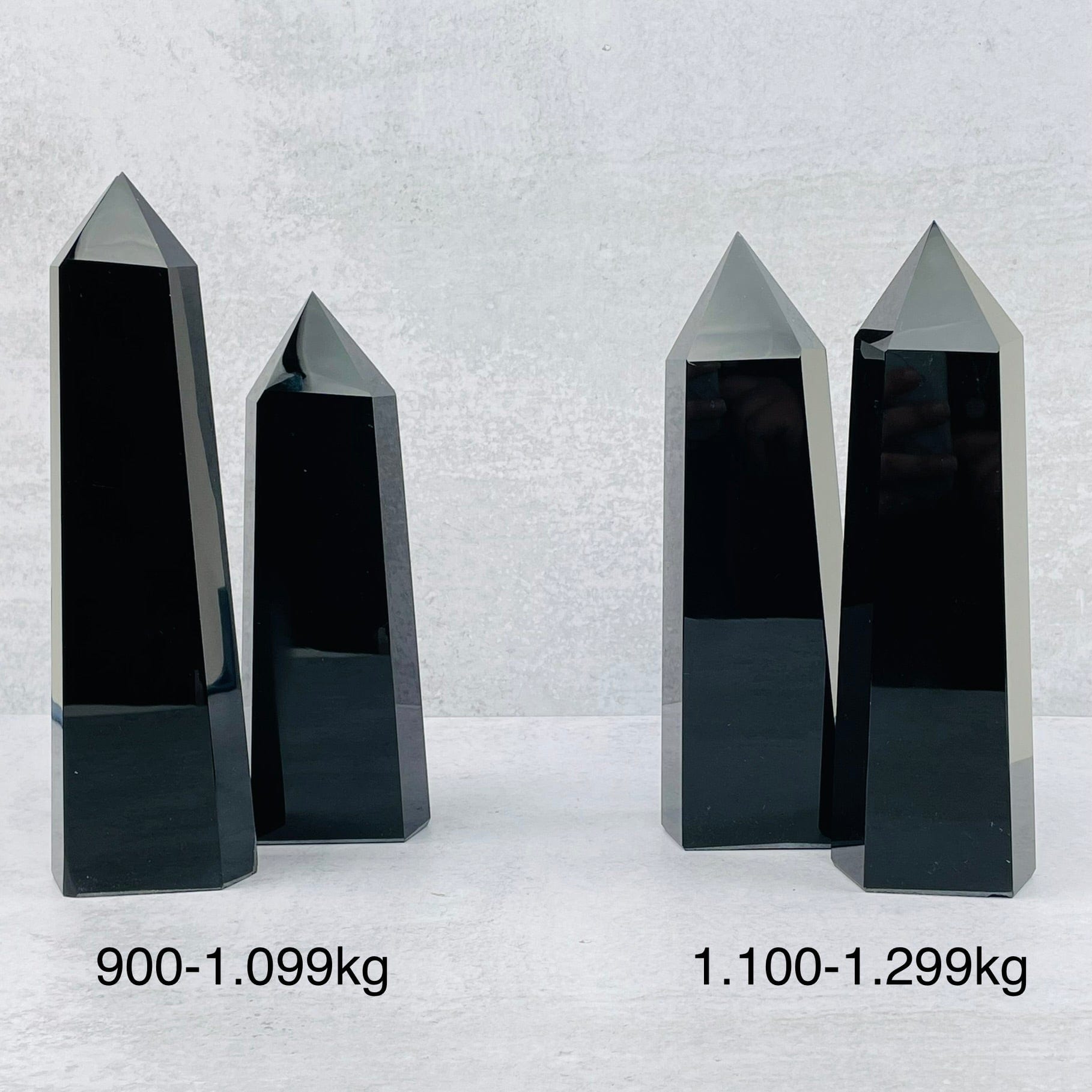 black obsidian towers next to their sizes 