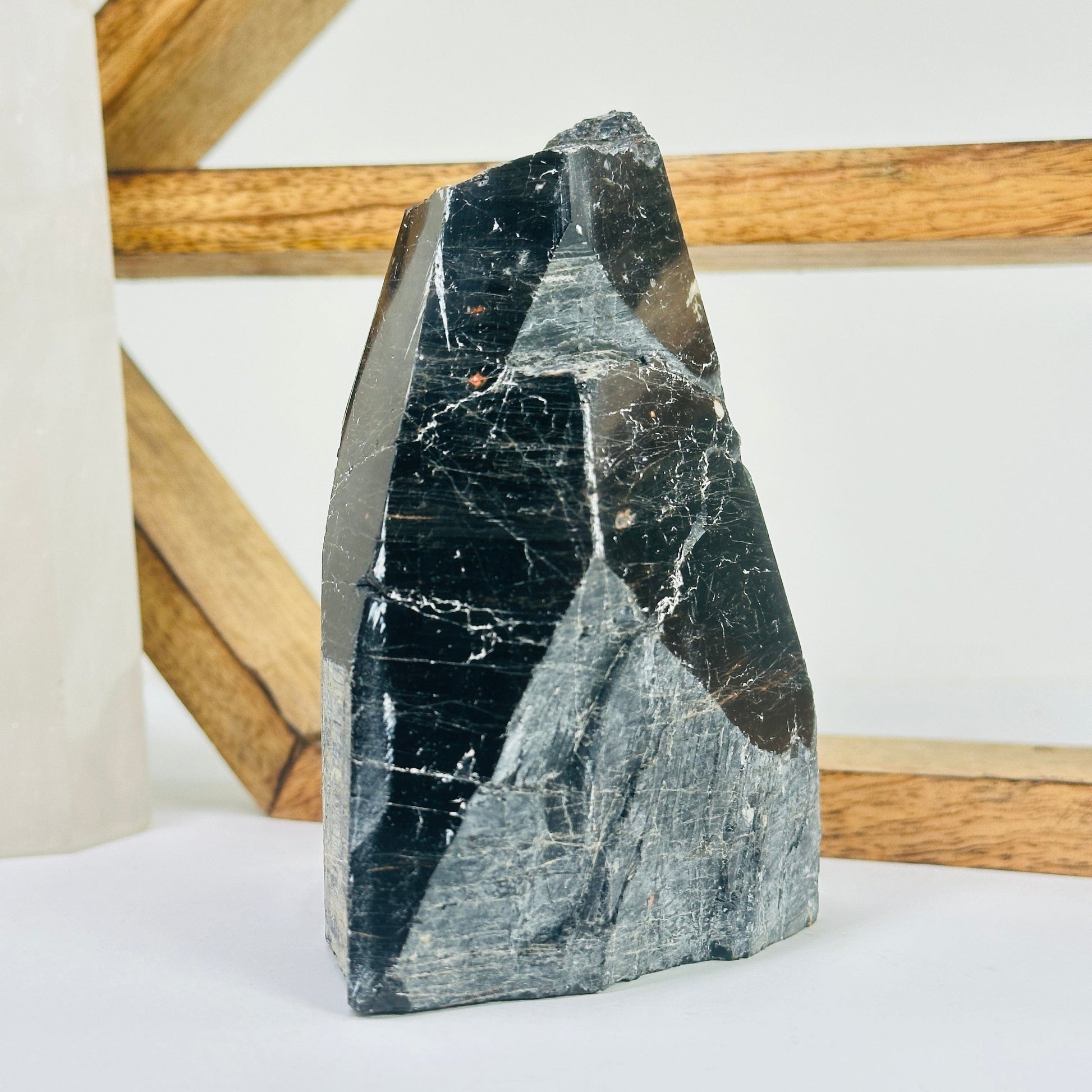 tourmaline point with decorations in the background
