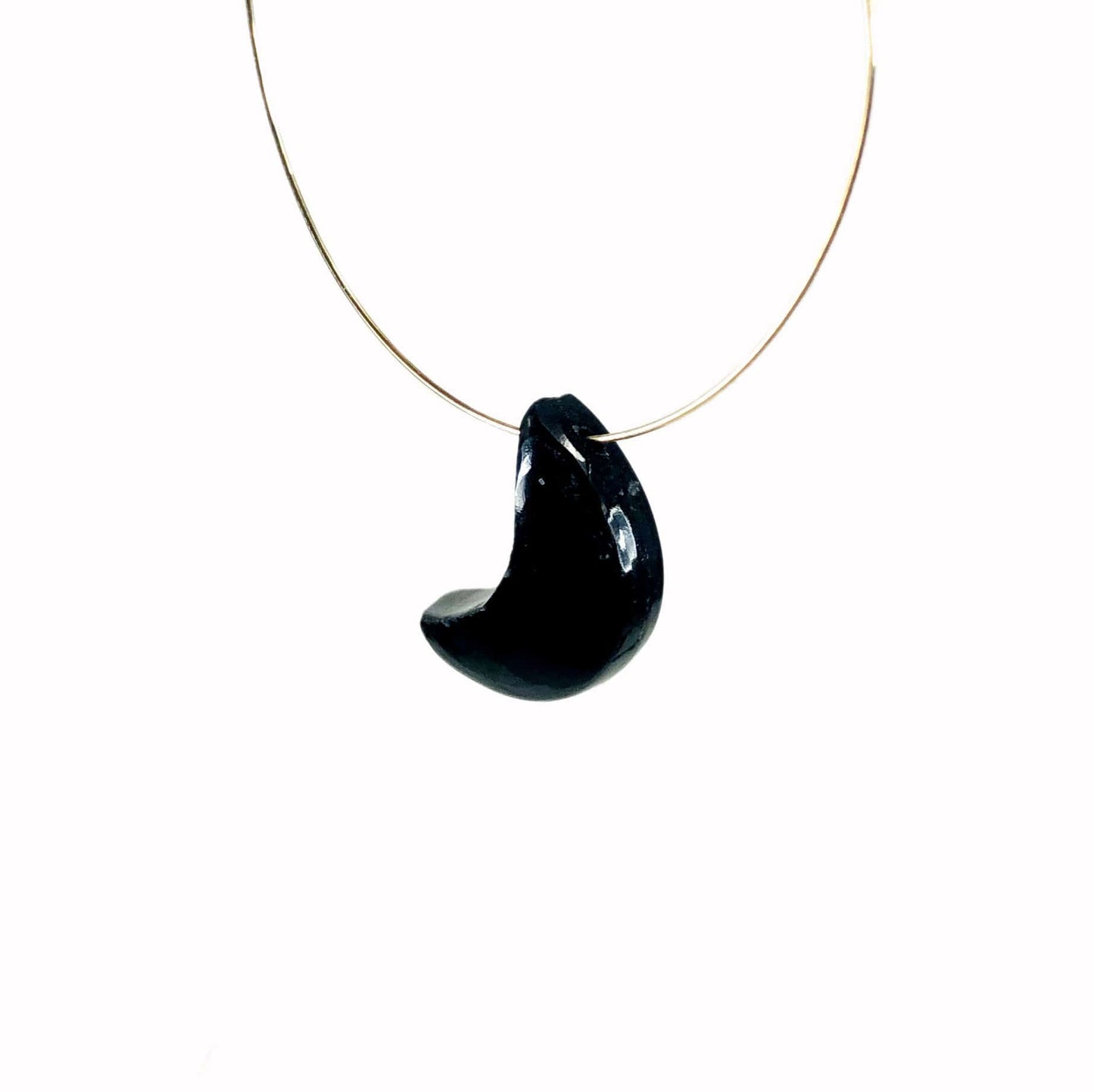 a gemstone moon bead on a wire
