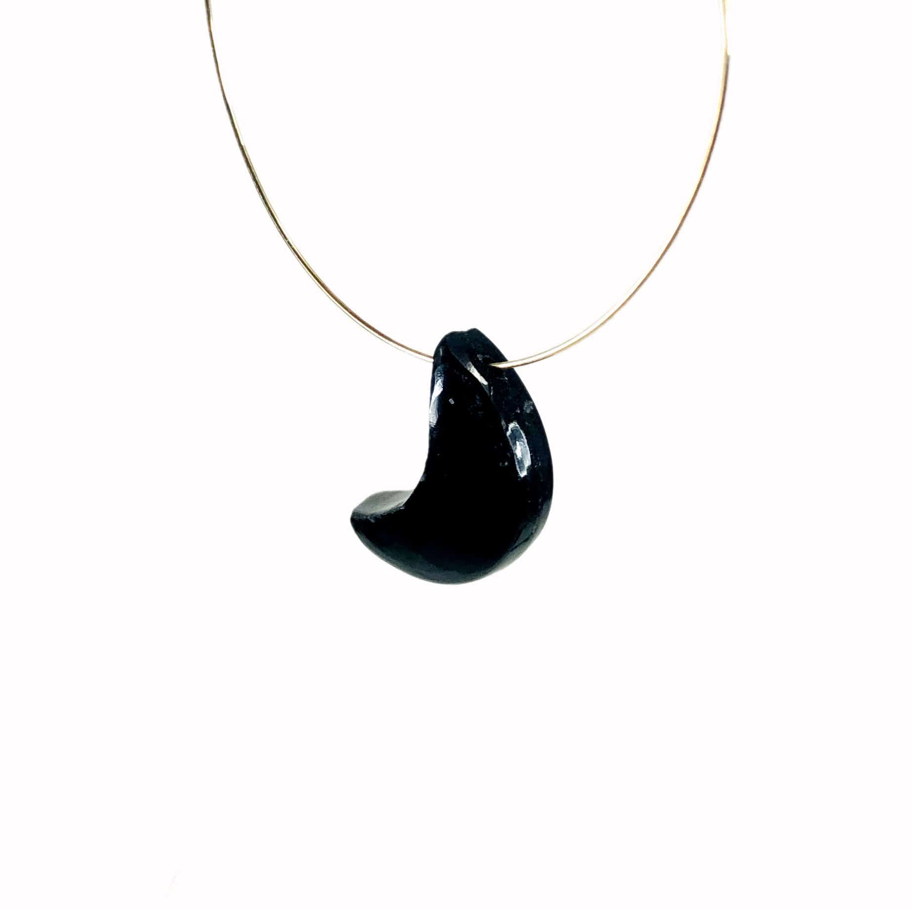 a gemstone moon bead on a wire