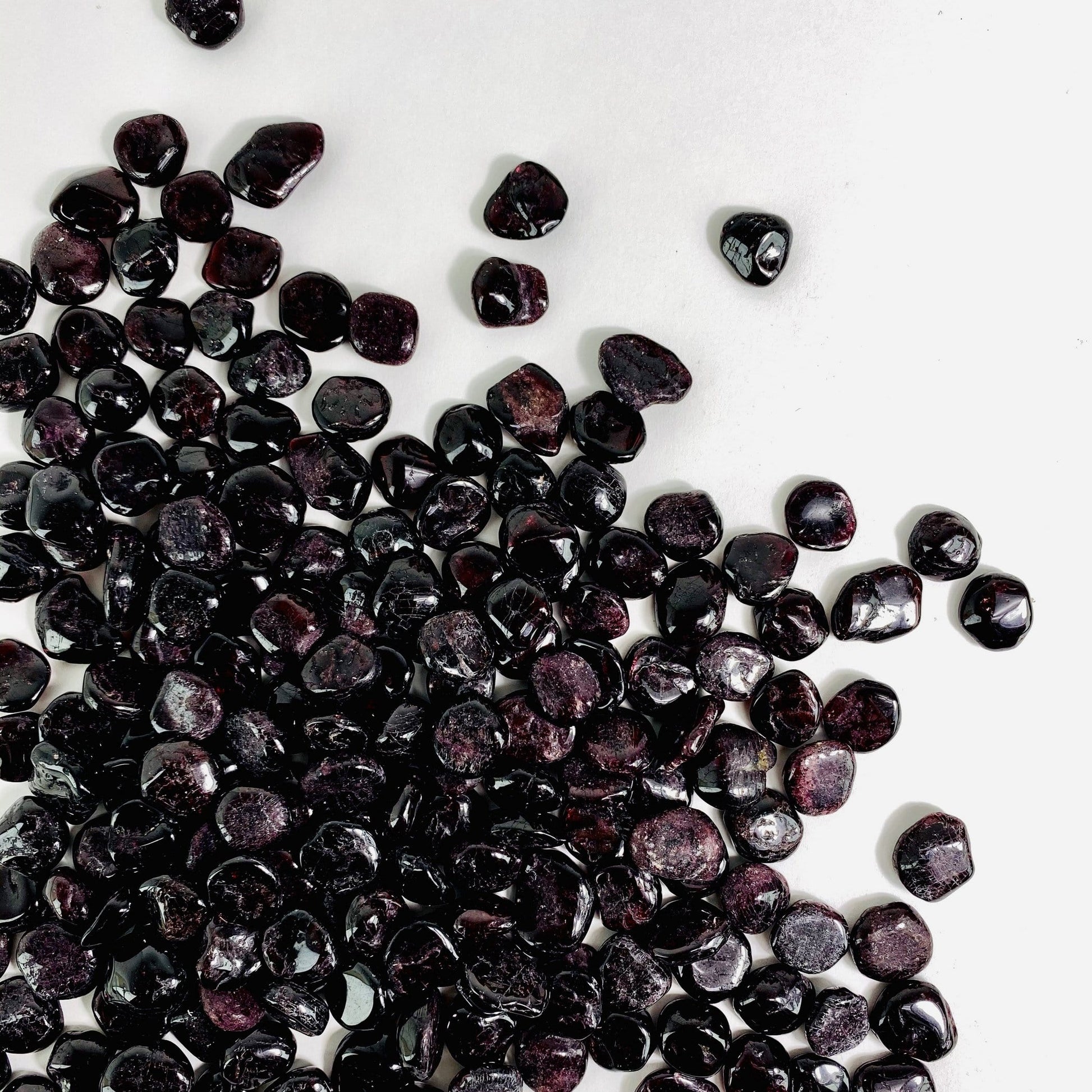 garnet chips spread on white background