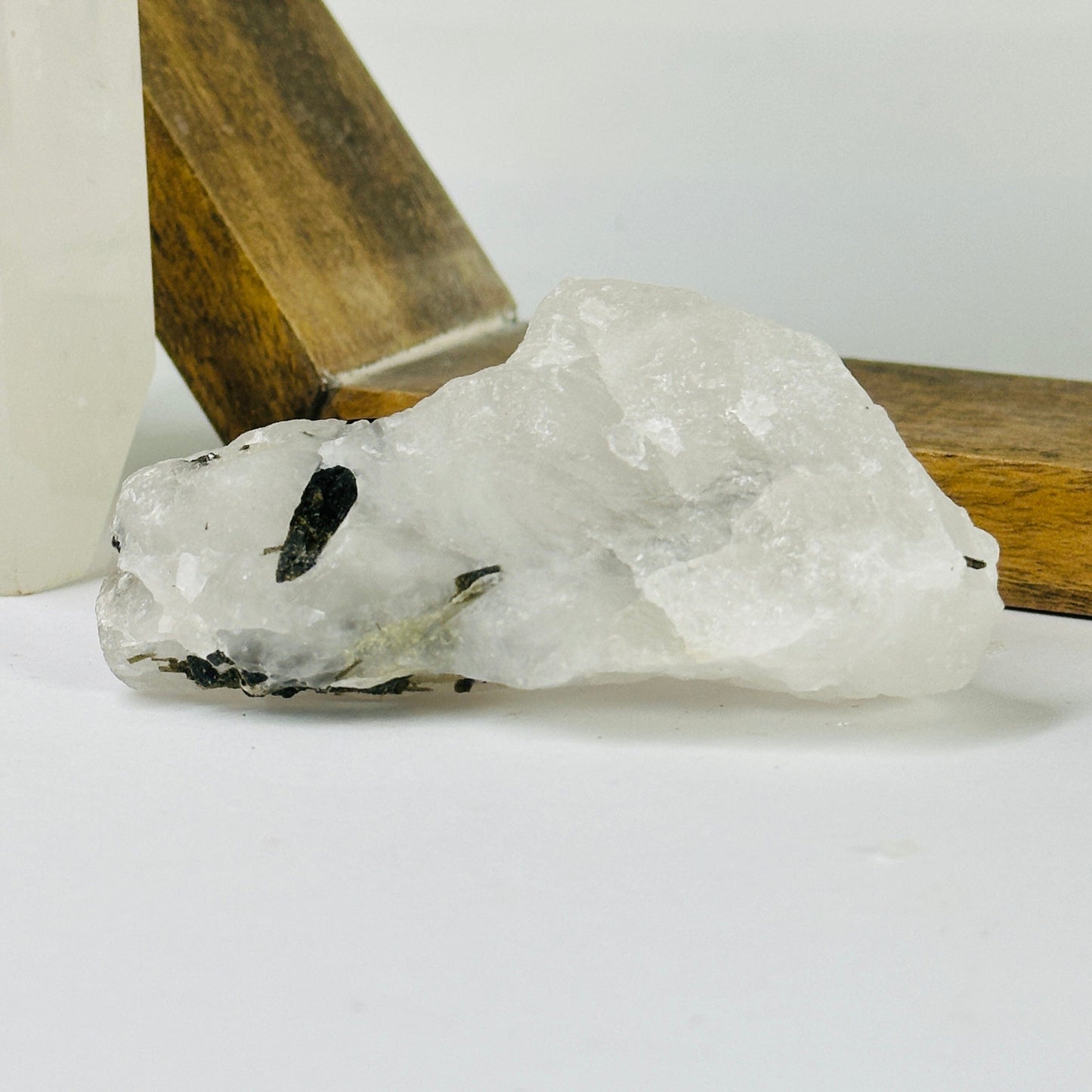 epidote on matrix with decorations in the background