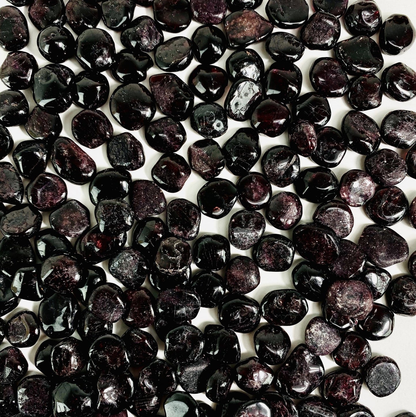 garnet chips spread on white background