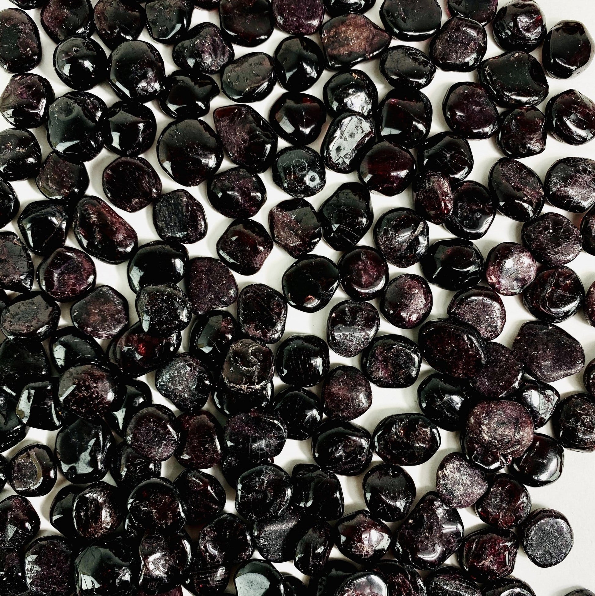 garnet chips spread on white background