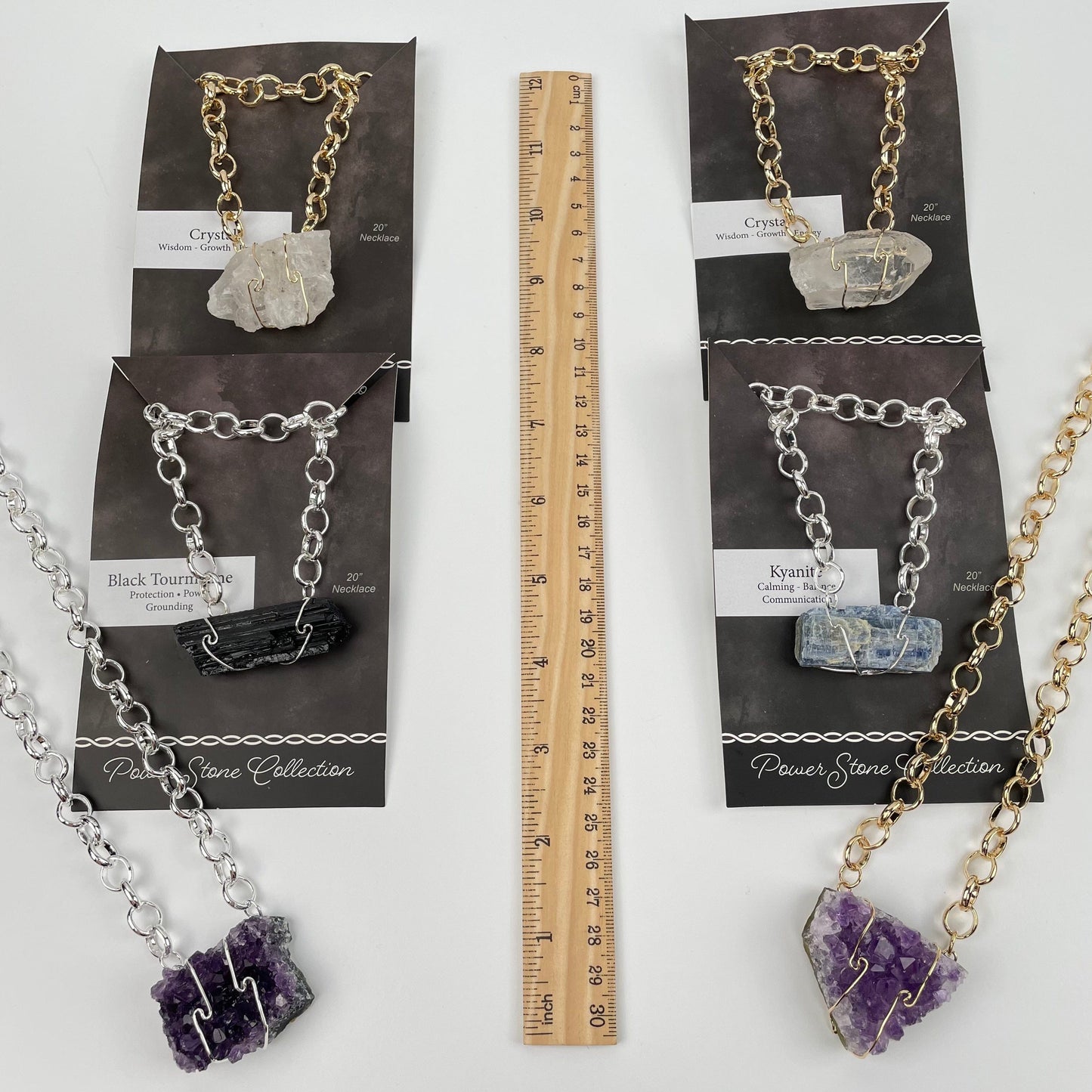 necklaces next to a ruler for size reference 