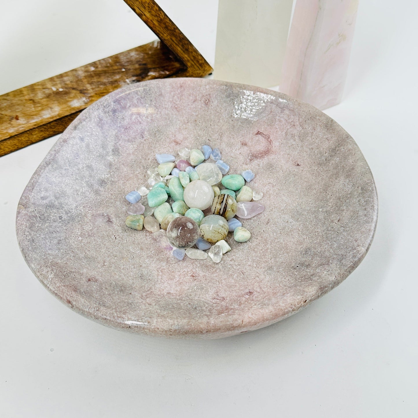 pink amethyst bowl with decorations in the background