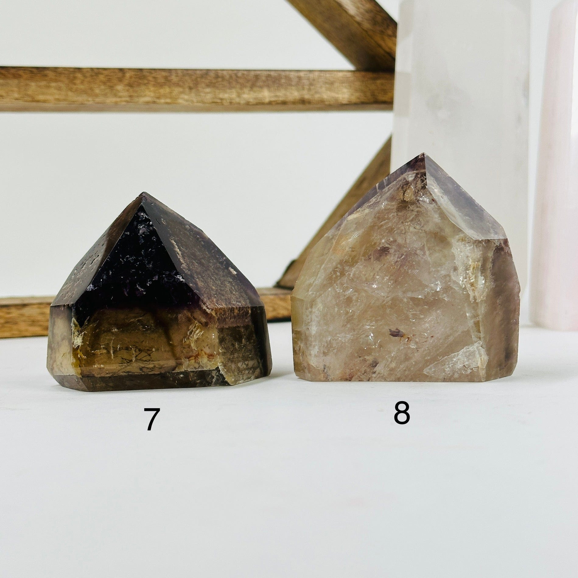 ametrine polished points with decorations in the background