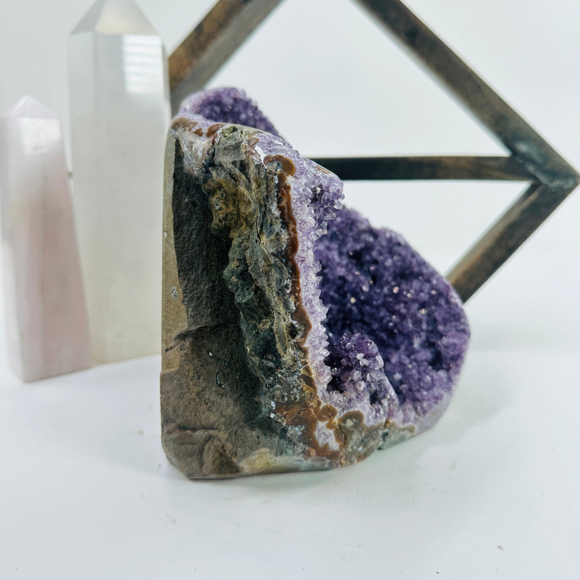 amethyst cut base with decorations in the background