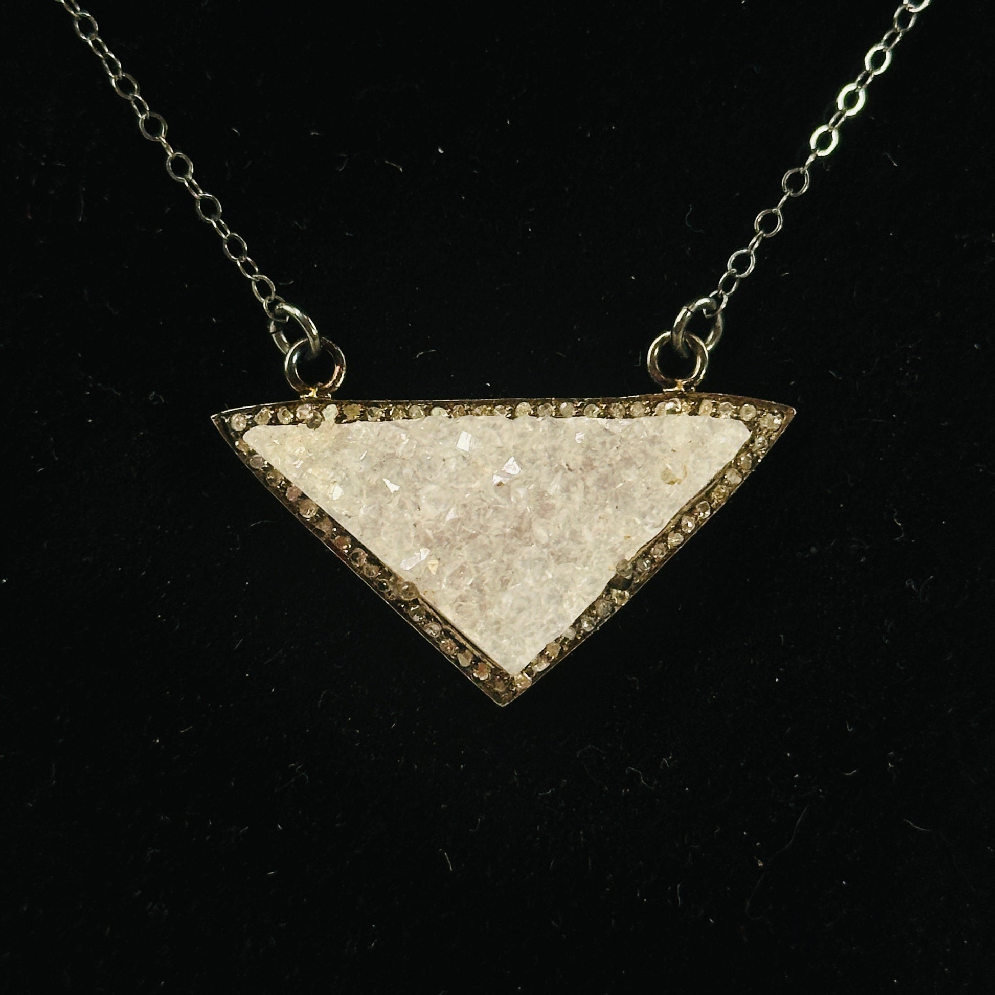 druzy pendant necklace on black background
