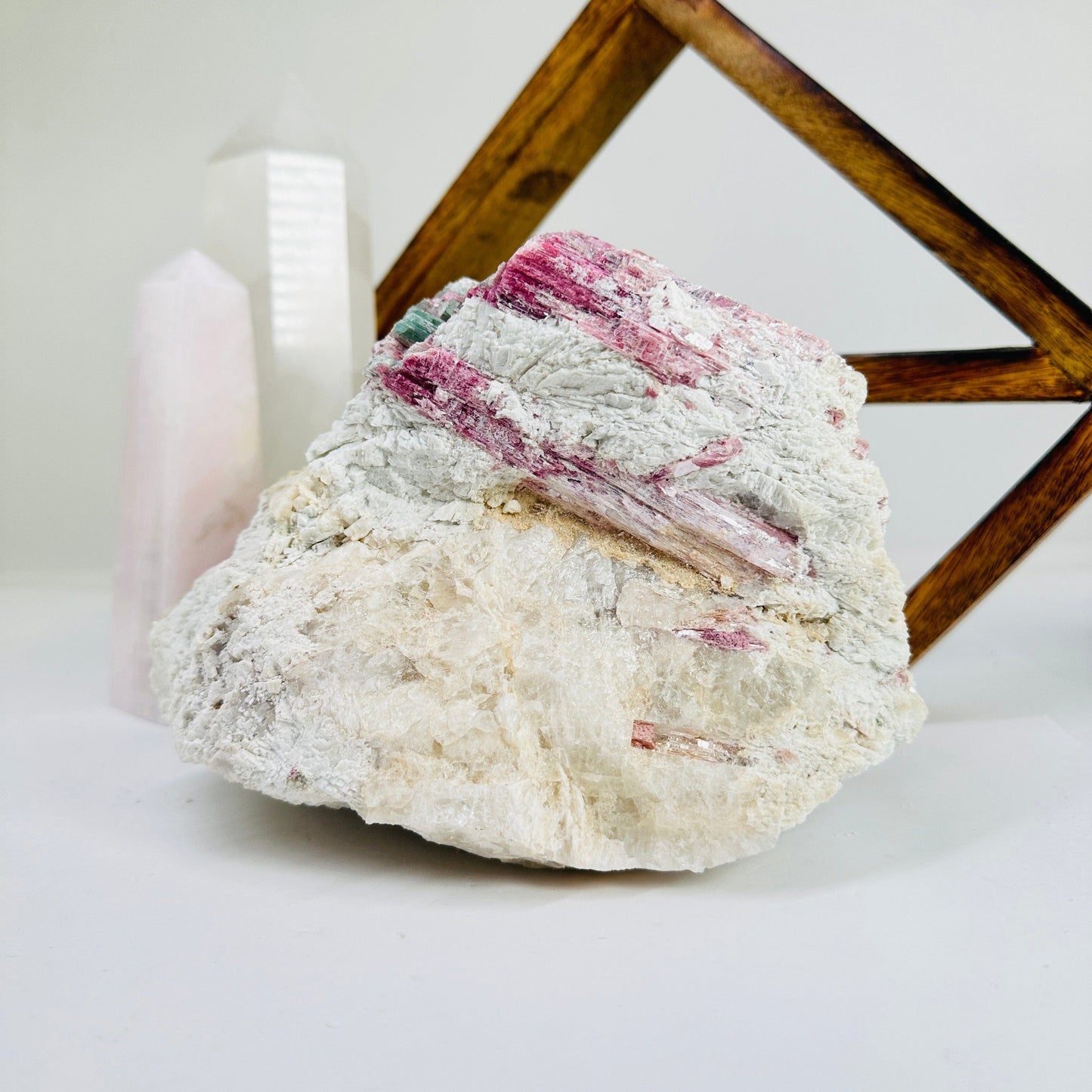 watermelon tourmaline with decorations in the background