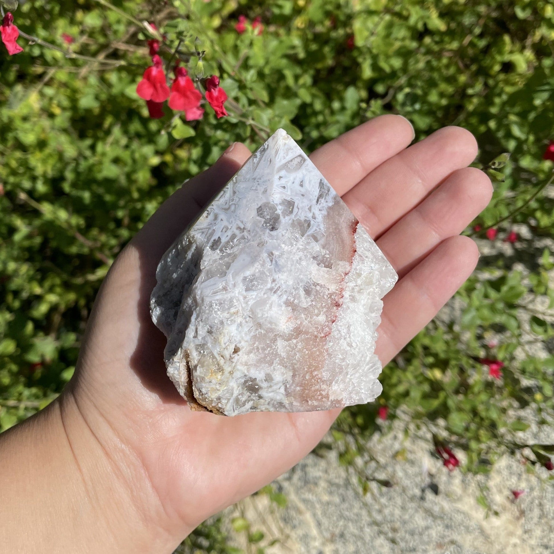 Pink Amethyst Point - Semi-polished Point in a hand for size reference