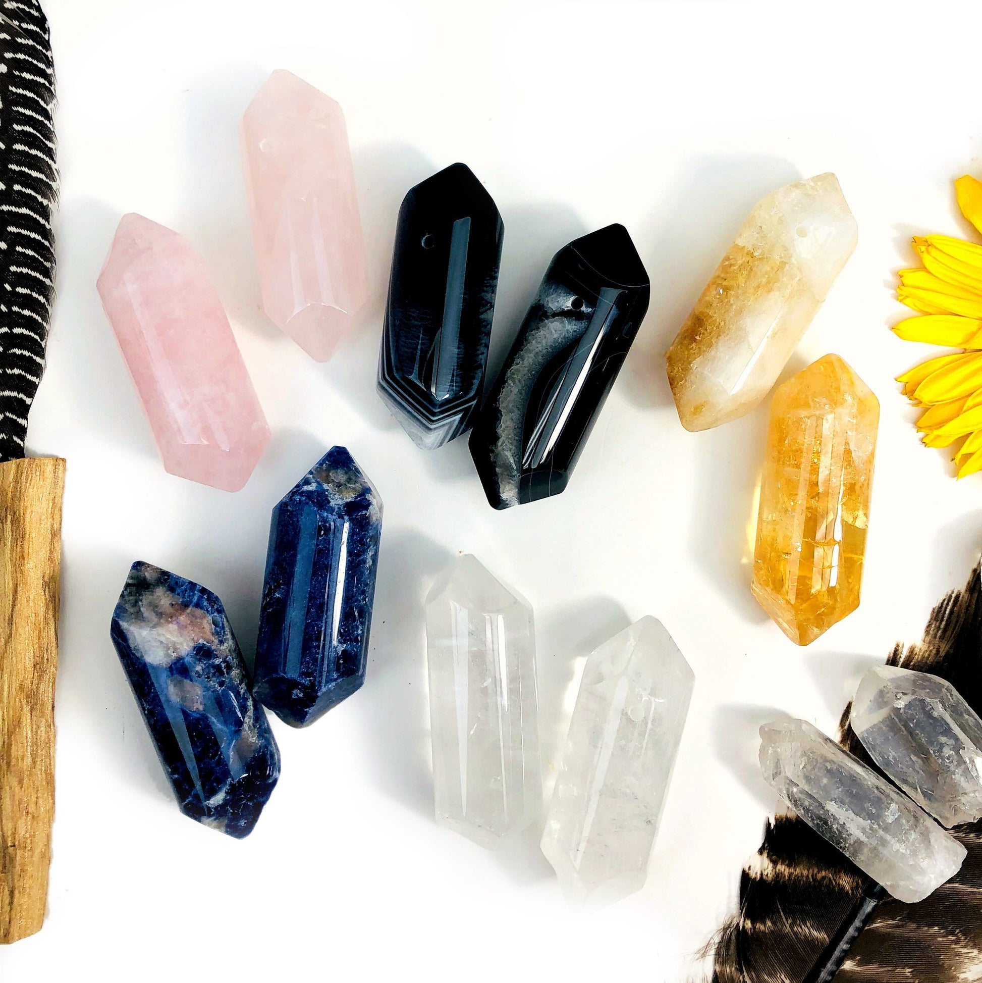 rose quartz black agate citrine (heat treated amethyst) sodalite crystal quartz  showing various characteristics and view of top driller hole