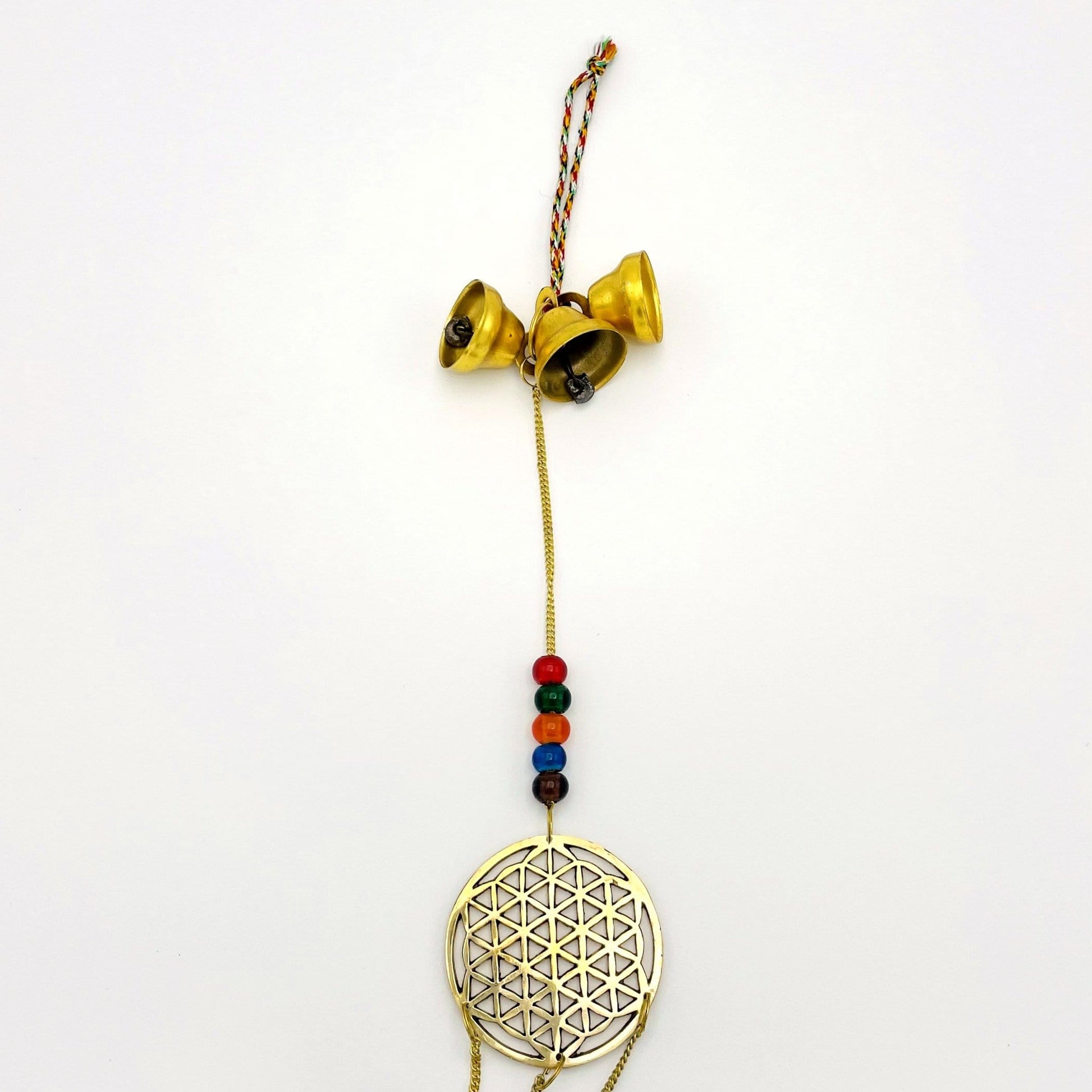 up close shot of Brass Triple Bell Hanging Flower of Life