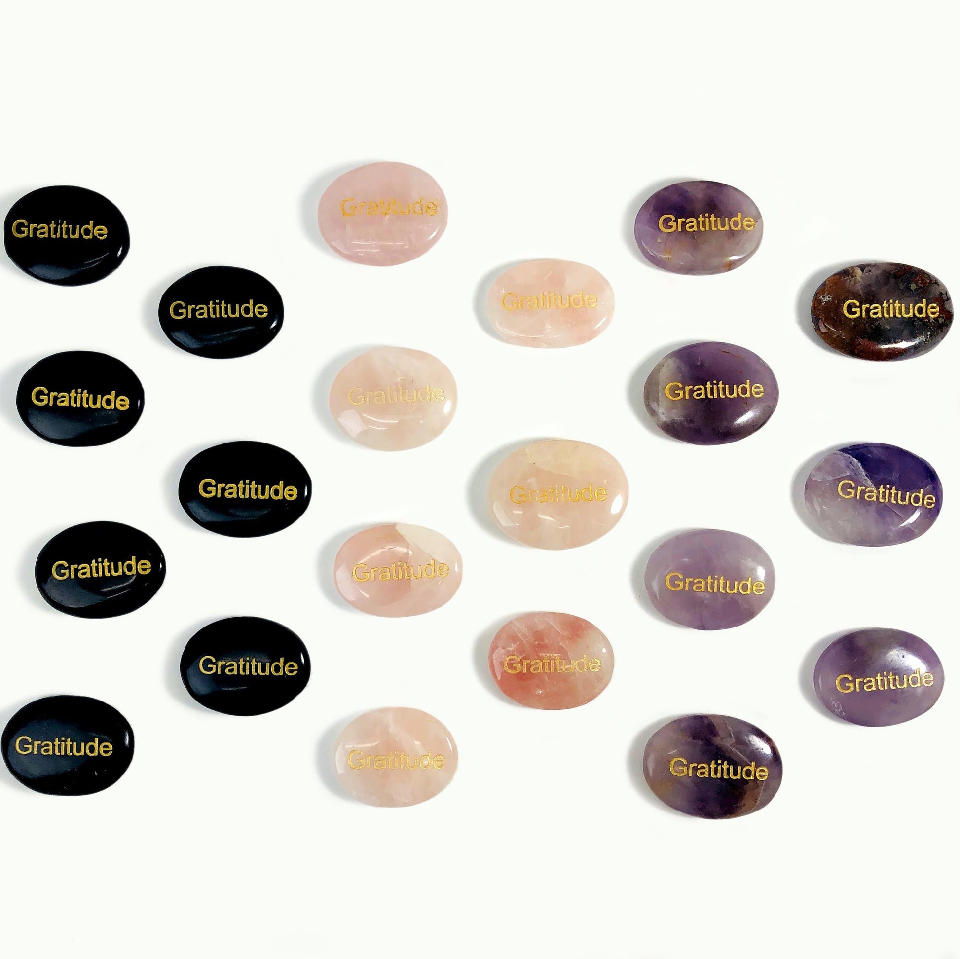 Pocket Stone "Gratitude" Palm Stones, seven of each, laid out on a white surface.