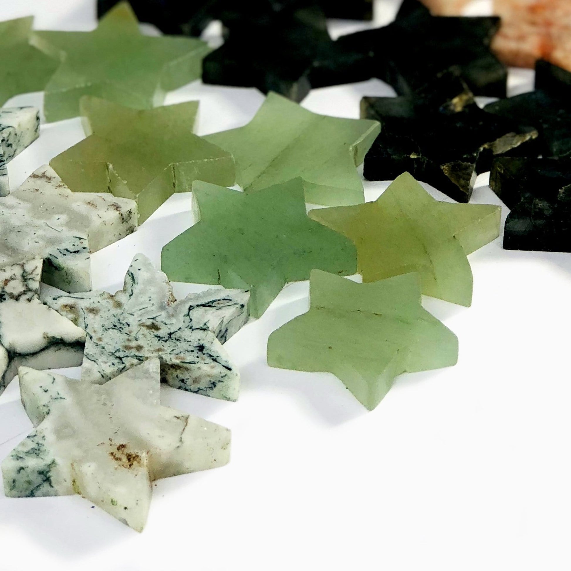 Gemstone Star Shaped Slices shown in varying stones, from side view 