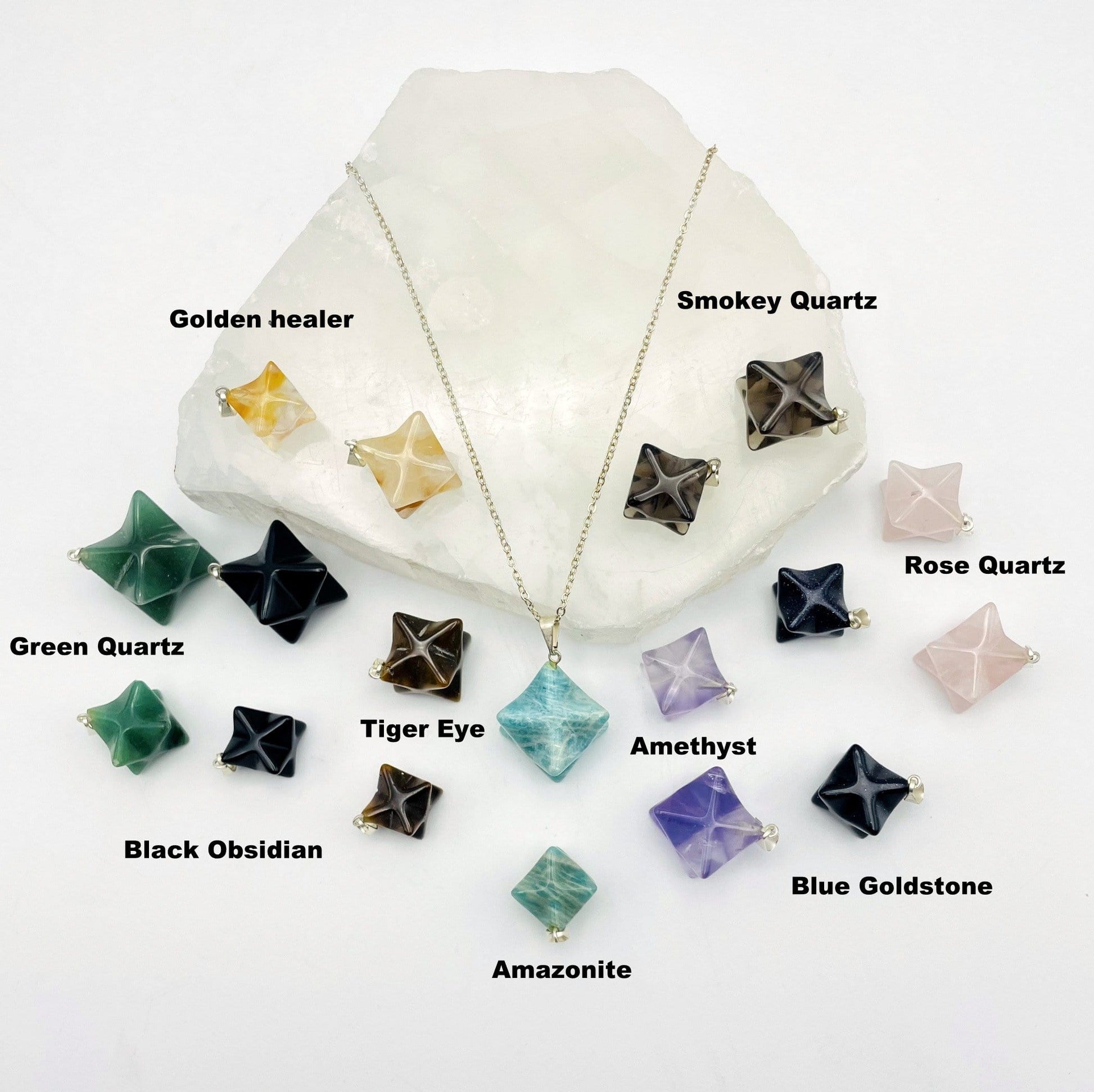 merkaba star pendants with silver toned bail displayed to show color variations between gemstones in Amethyst Green Quartz Blue Goldstone Tiger Eye Smokey Quartz Amazonite Black Obsidian Golden Healer Rose Quartz