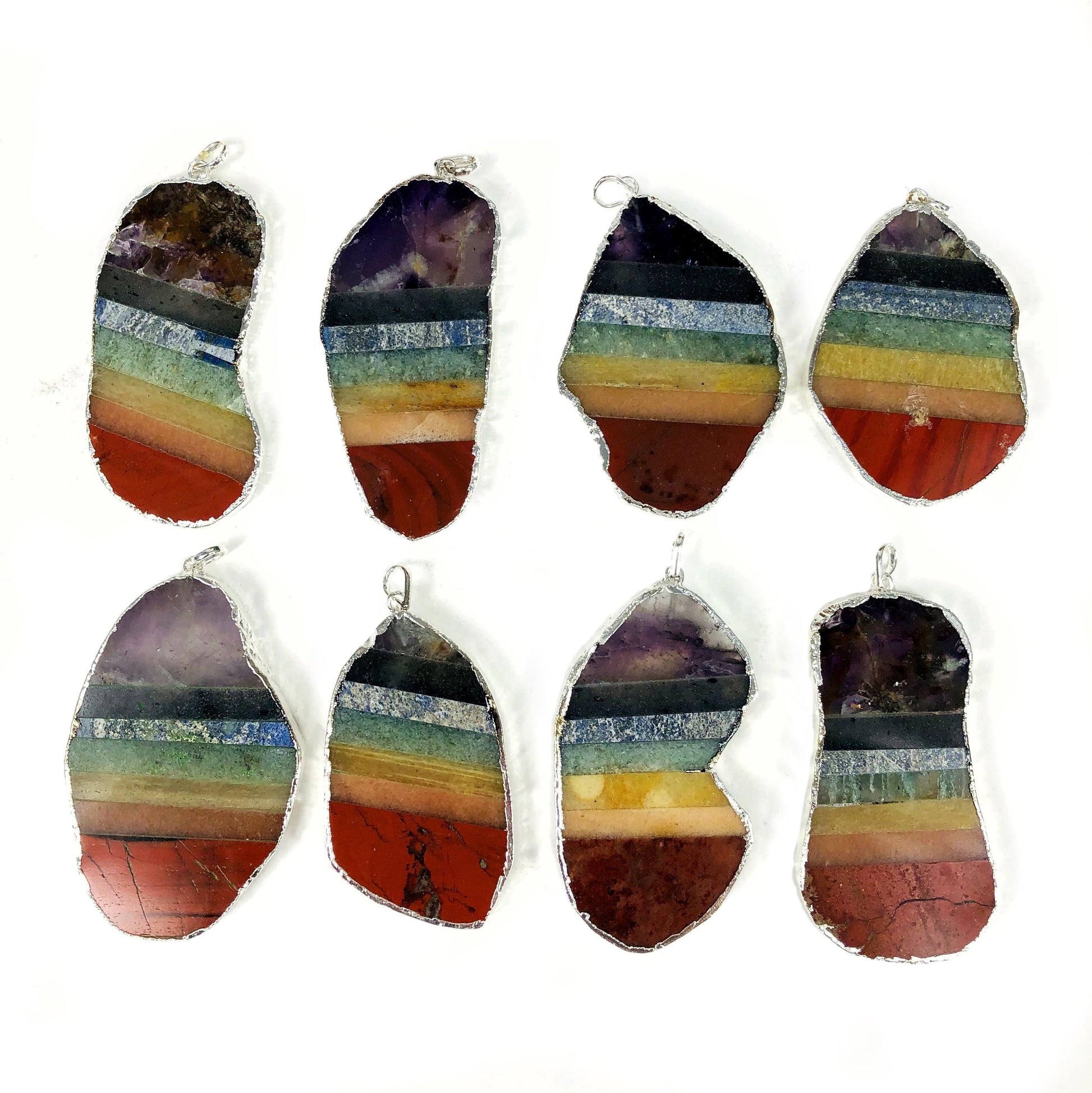 close up of the details on the silver electroplated chakra pendants 