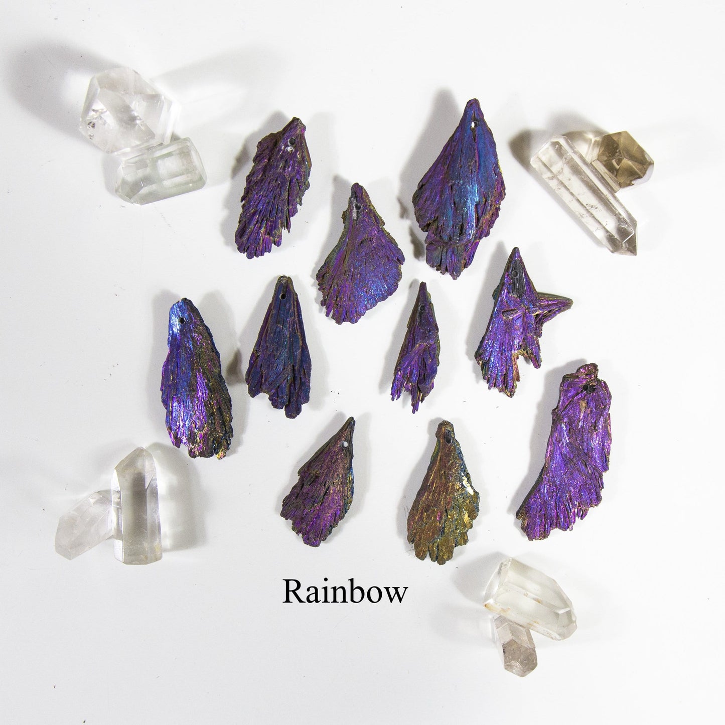 rainbow titanium treated kyanite blades with decorations on white background