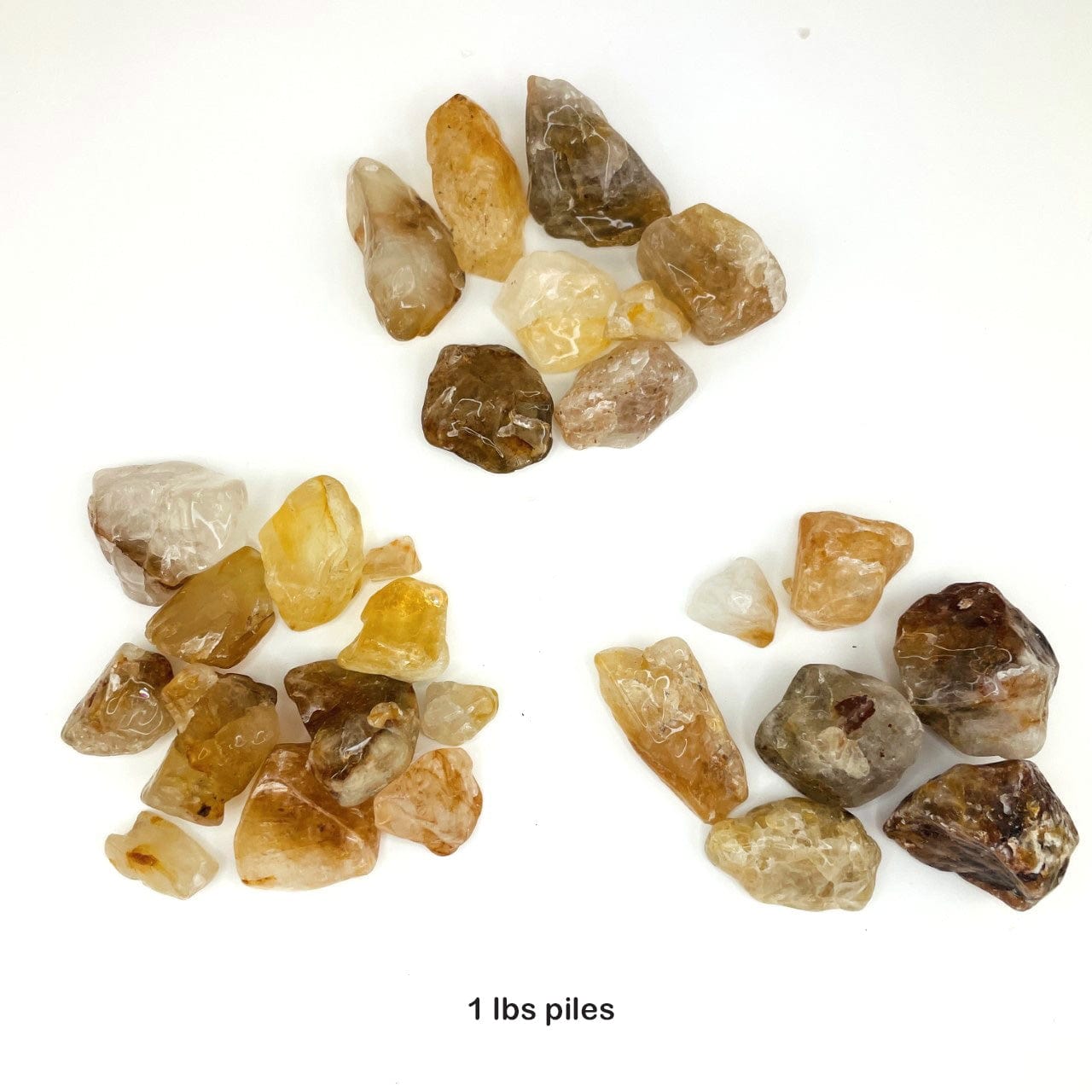 1 pound piles of Golden Healer Quartz Polished Tumbled Stones