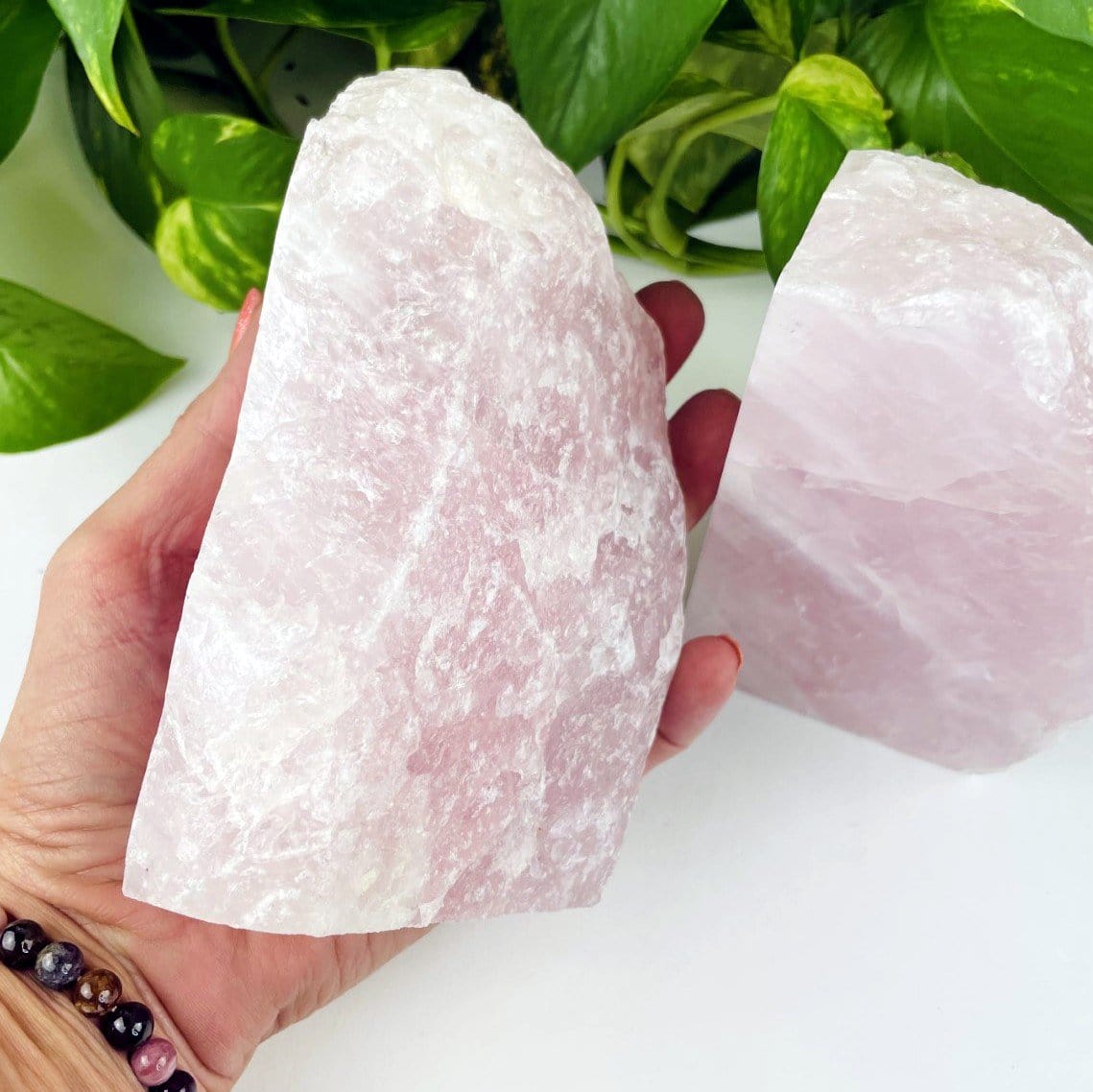 Rose Quartz Bookend Set - one half in a hand