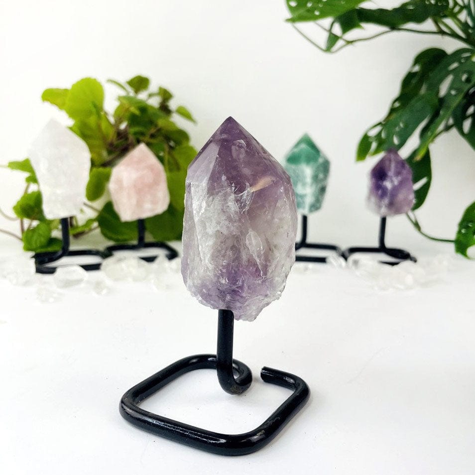 Semi Polished Points on Metal Stands up close of the amethyst