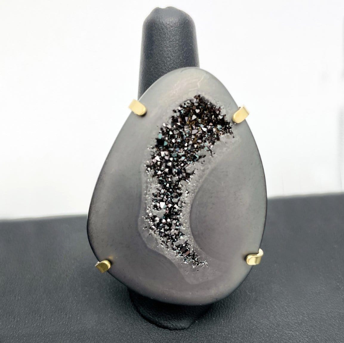 Close up of one black druzy ring showing it has a druzy in the center.