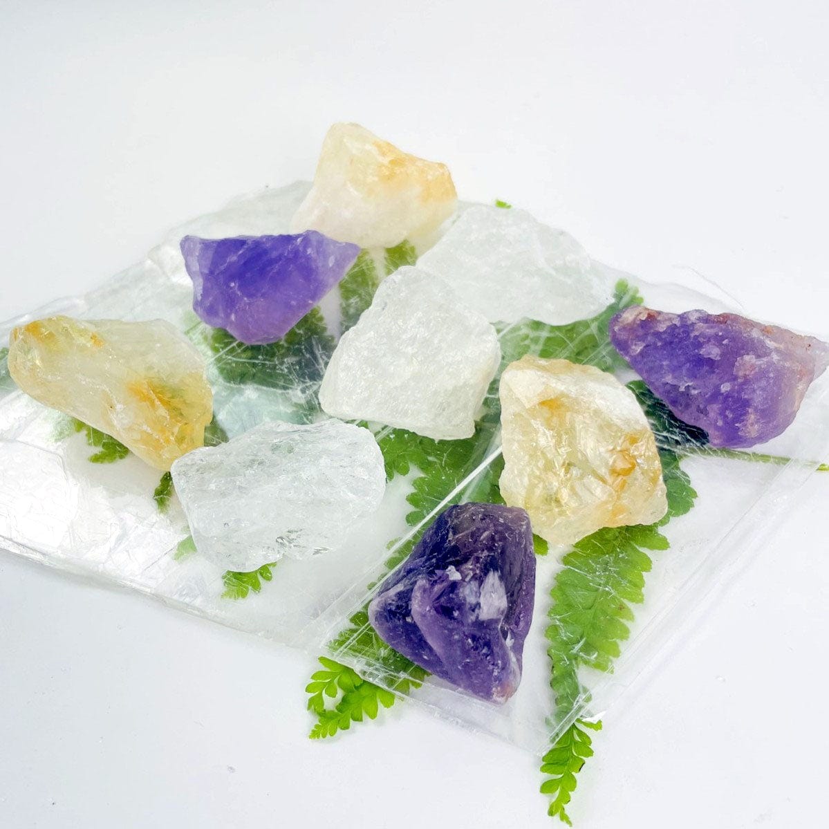 Amethyst, Quartz, and Citrine stones from side view showing  sizes and shapes