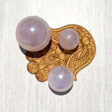 3 Rose Quartz Angel Aura Titanium Spheres on a hand shaped coaster