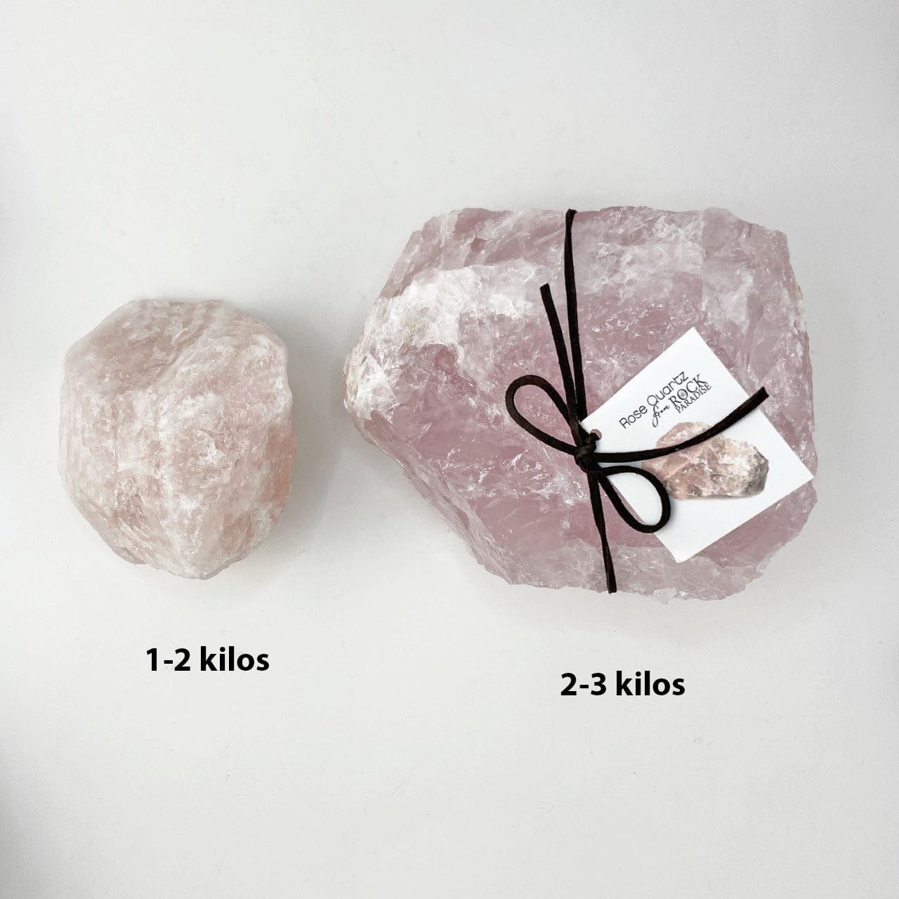 2 rose quartz stones, one is 1-2 kilos and the other is 2-3 kilos