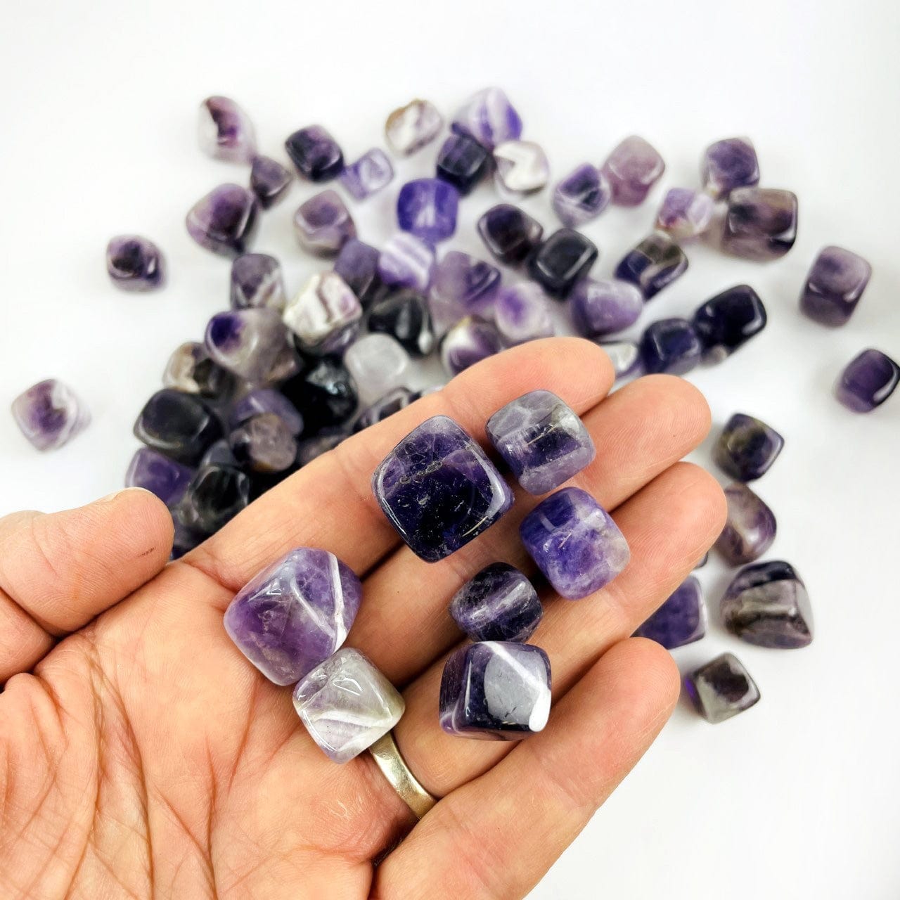 tumbled stones in hand for size reference 