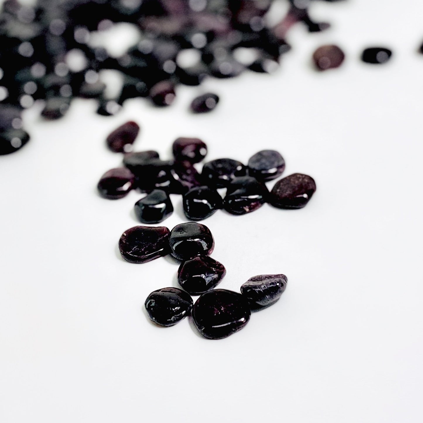 garnet chips spread on white background