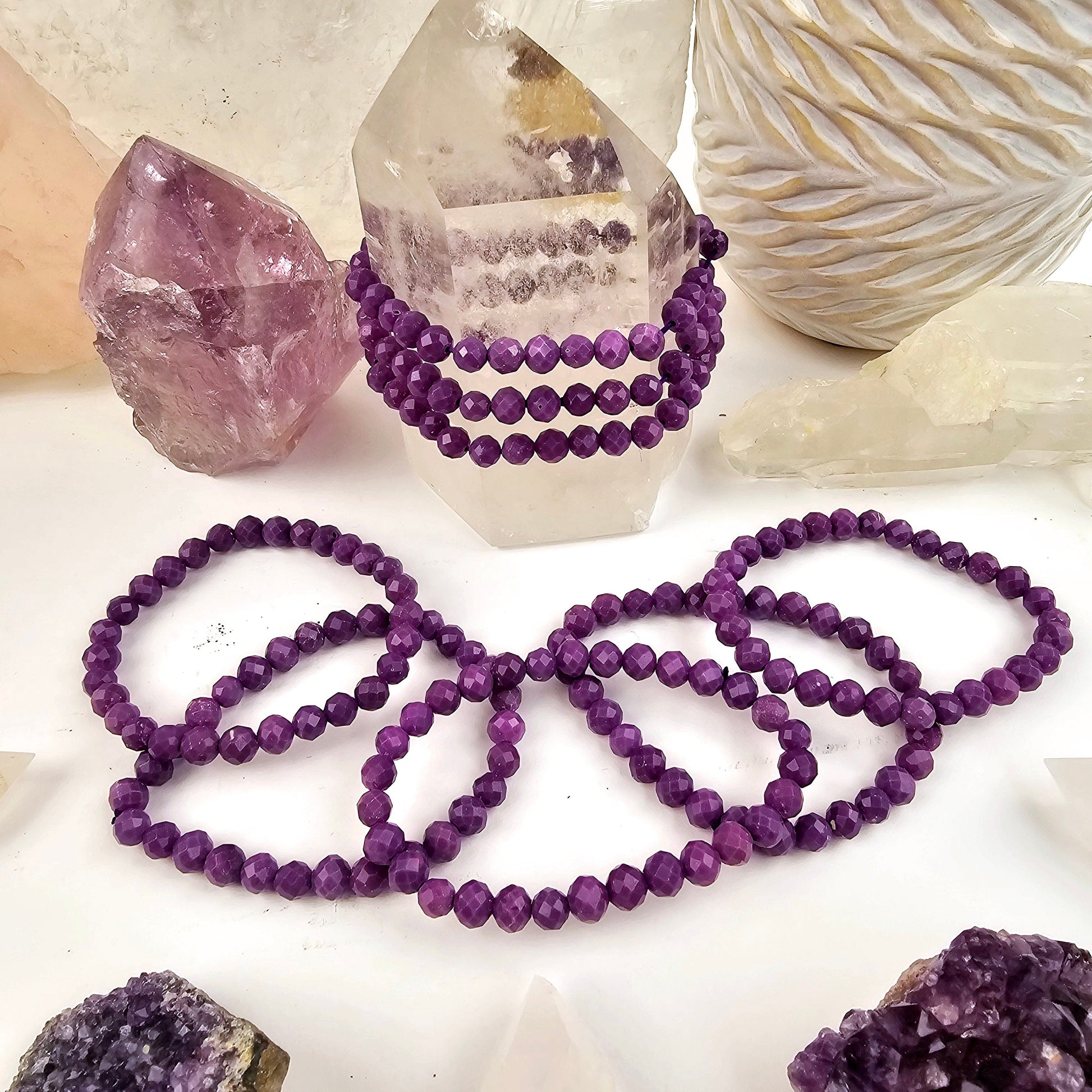 Phosphosiderite Faceted Round Bead Bracelet - 6mm on quartz point and arranged around quartz point